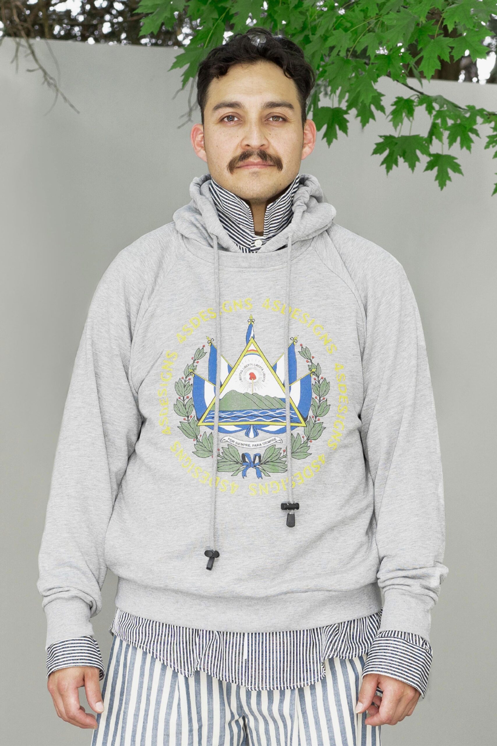 gray hoodie with striped shirt and pants