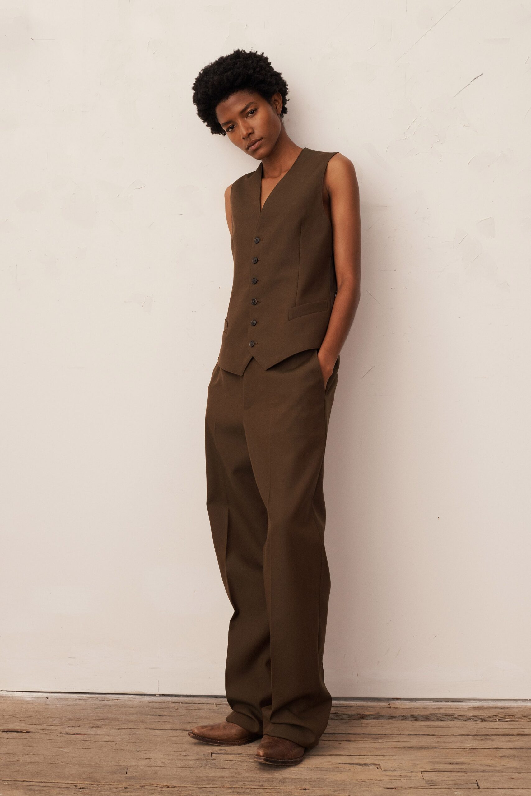brown fitted vest and relaxed pants