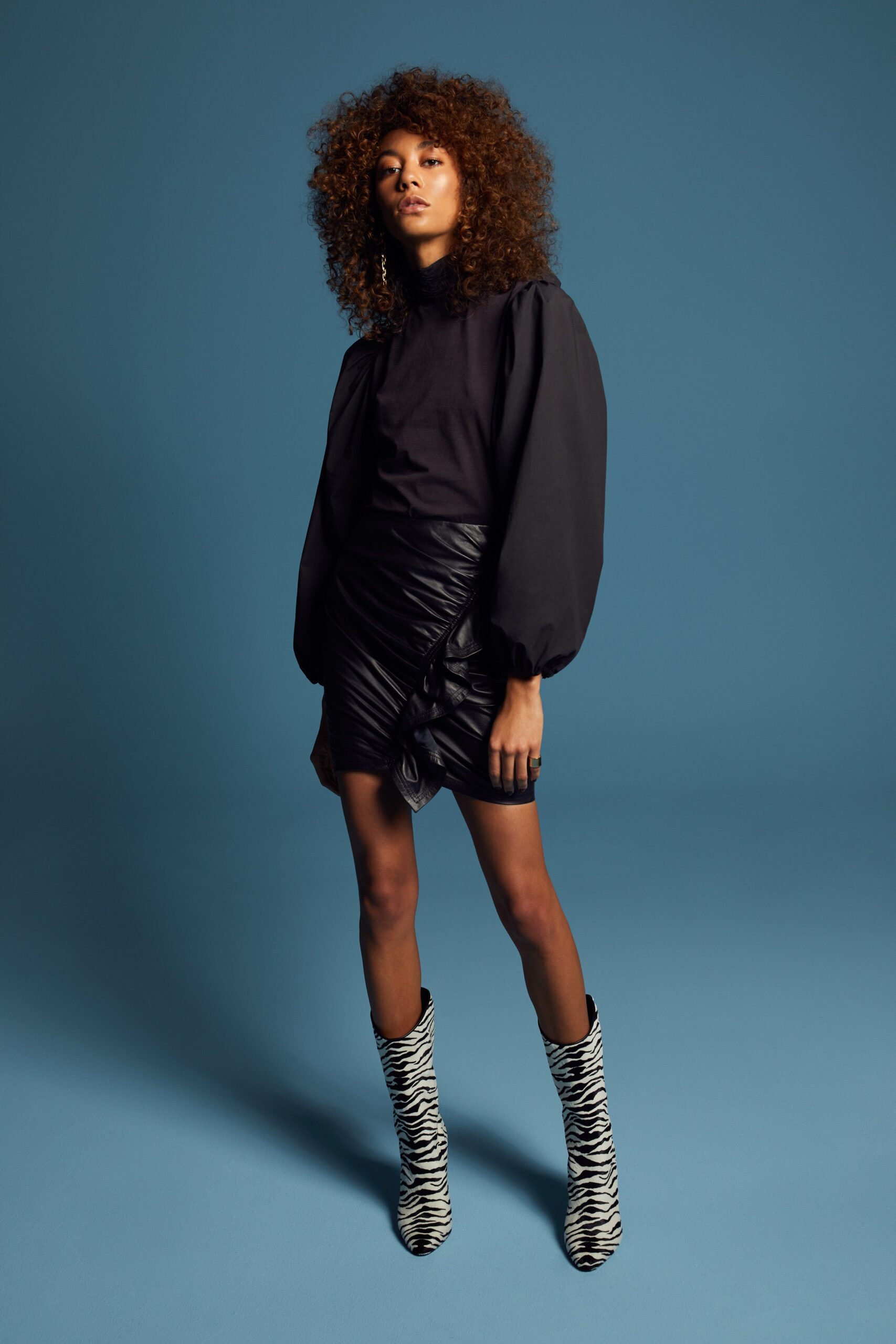 black blouse and mini skirt