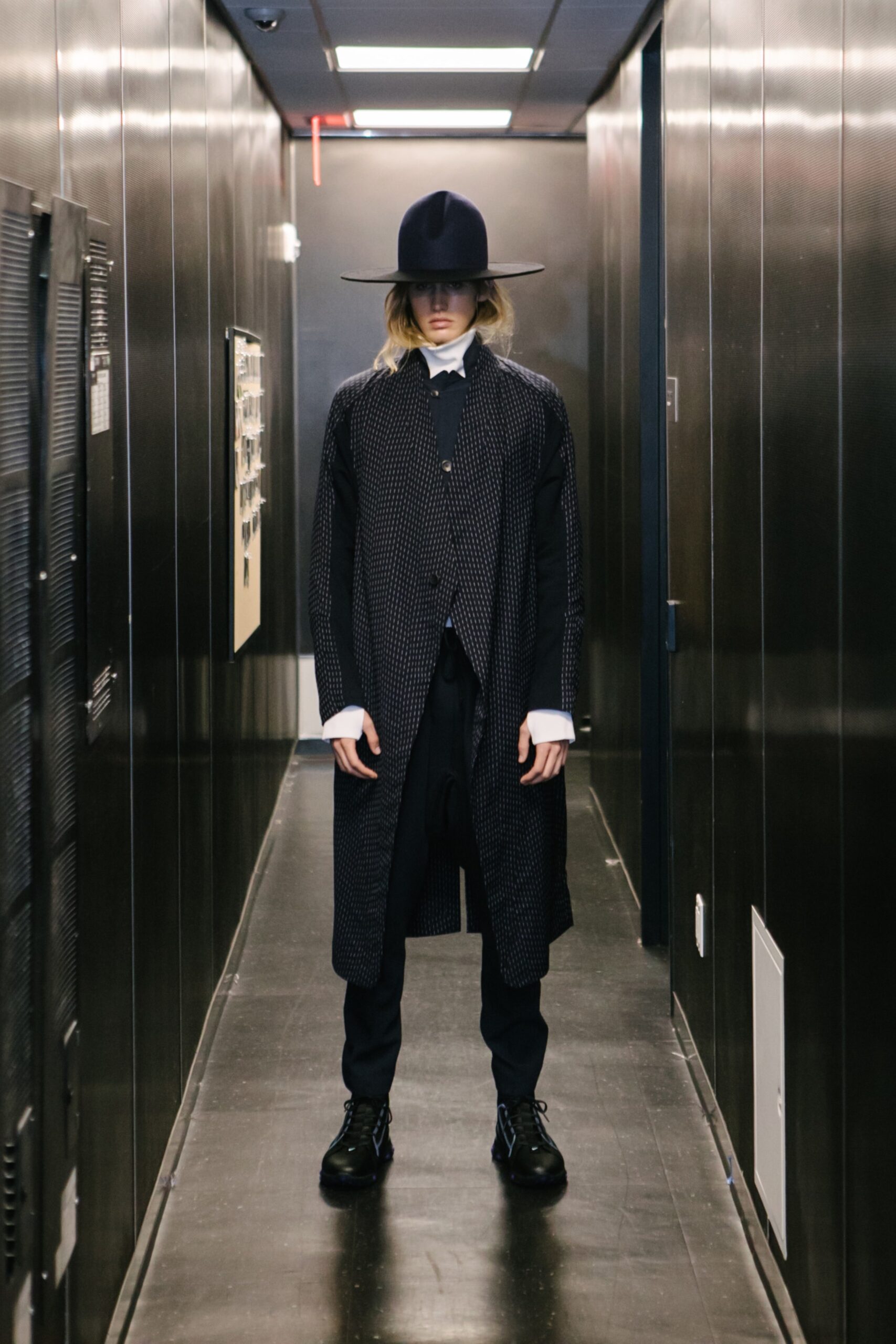 black relaxed coat with tailored pants