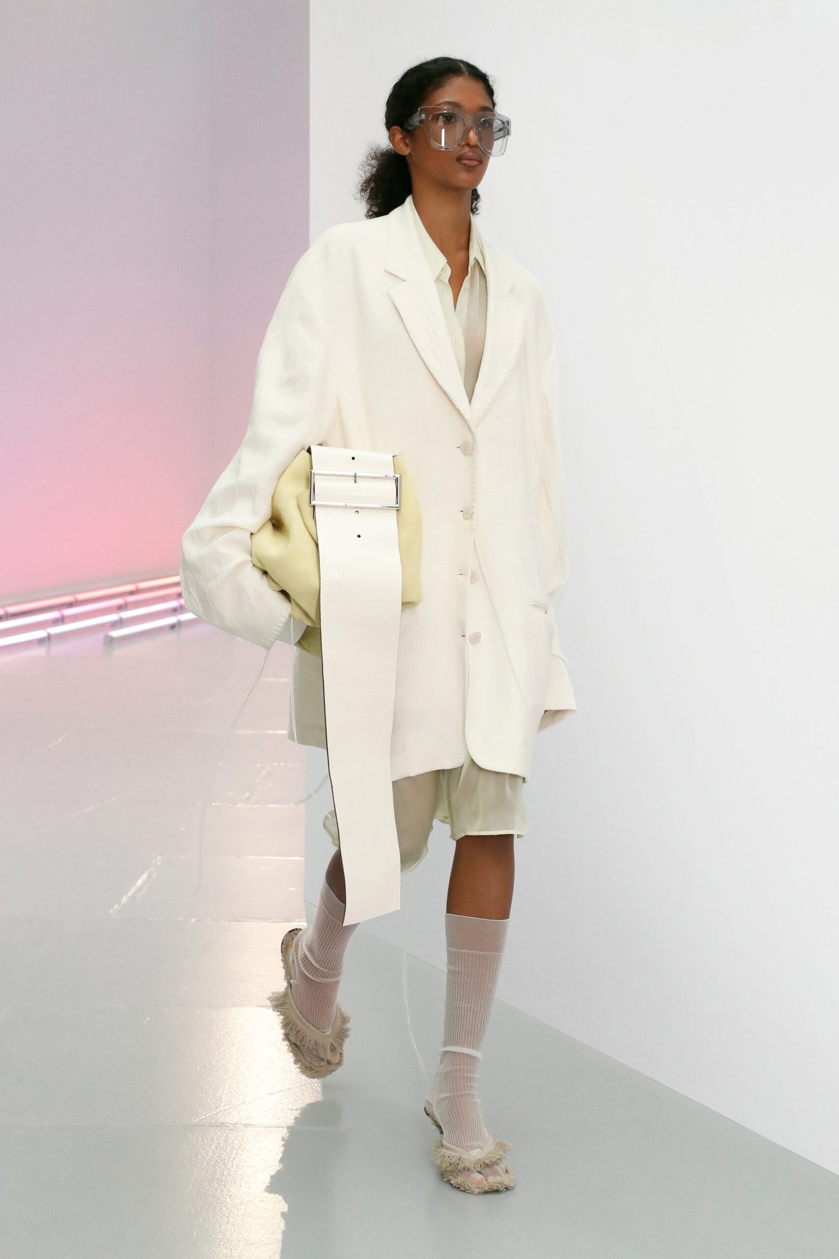 oversized white coat with pleated skirt