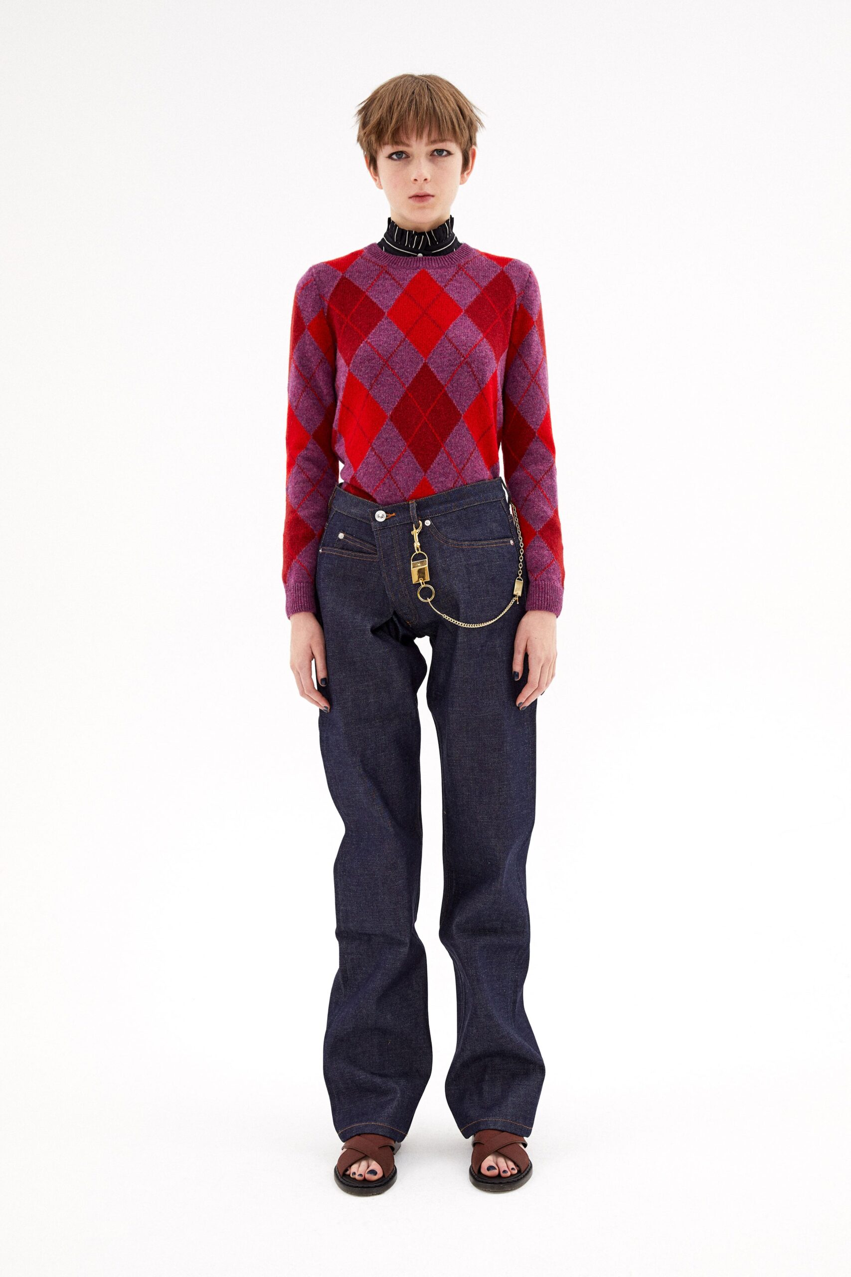 red purple argyle sweater with denim pants