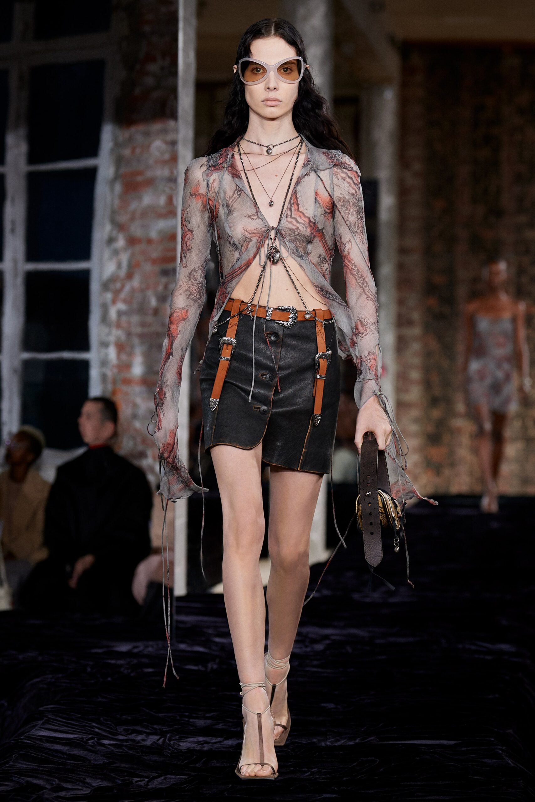 sheer black silk top and leather skirt