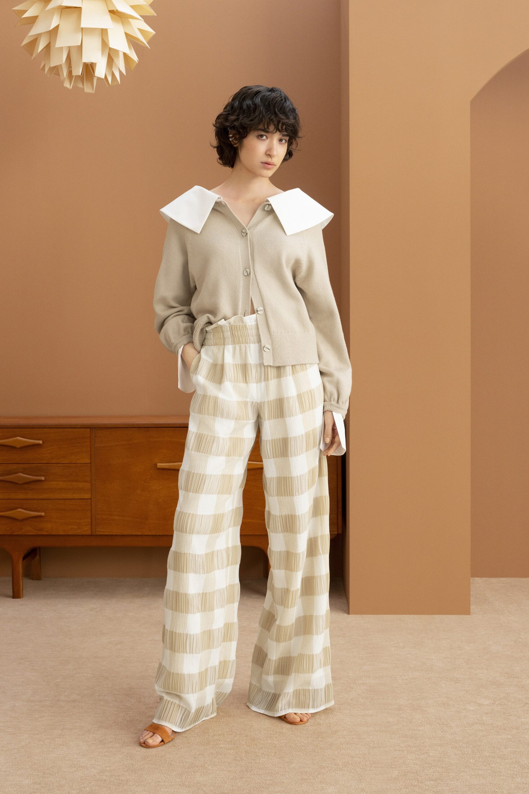 beige cardigan and striped pants