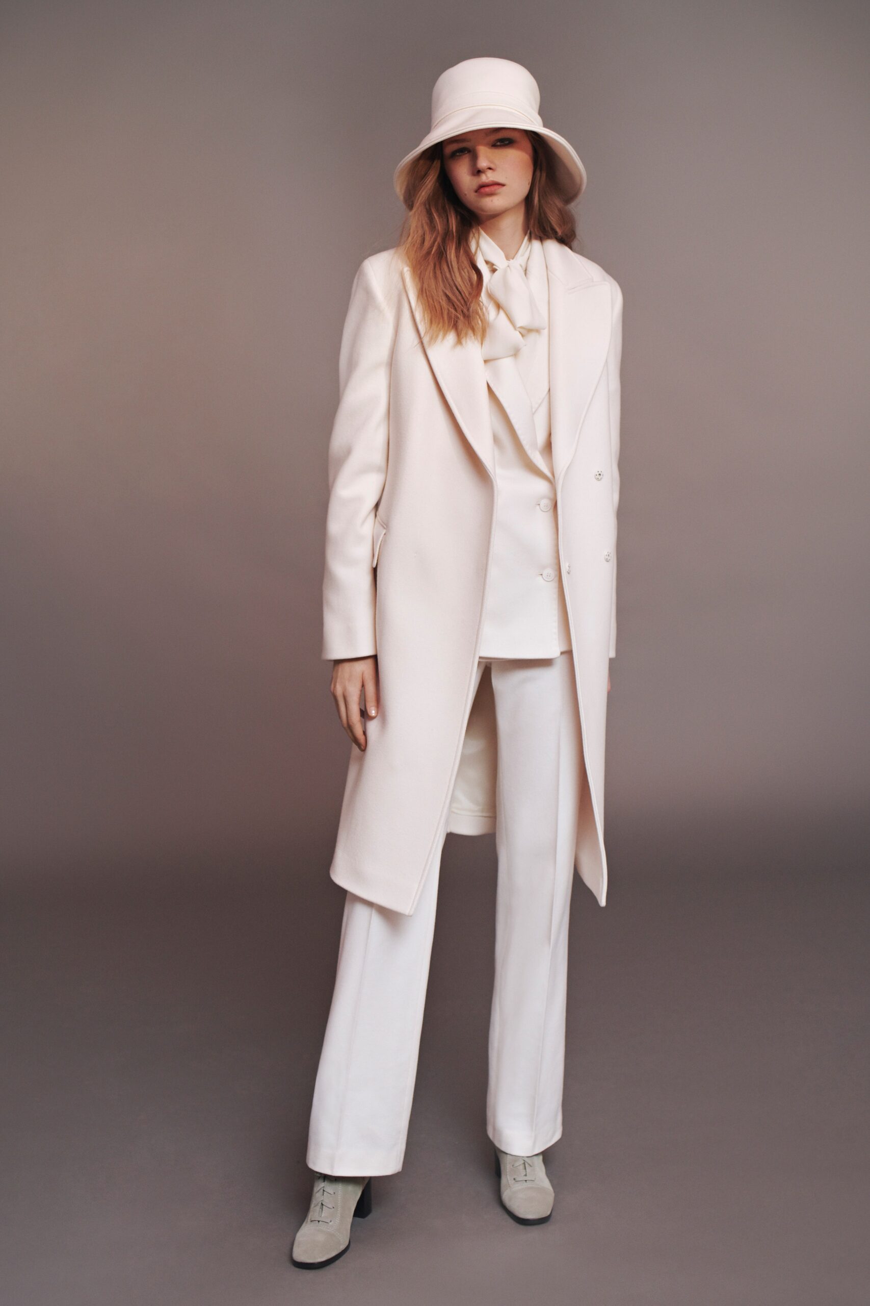 white tailored coat and pants