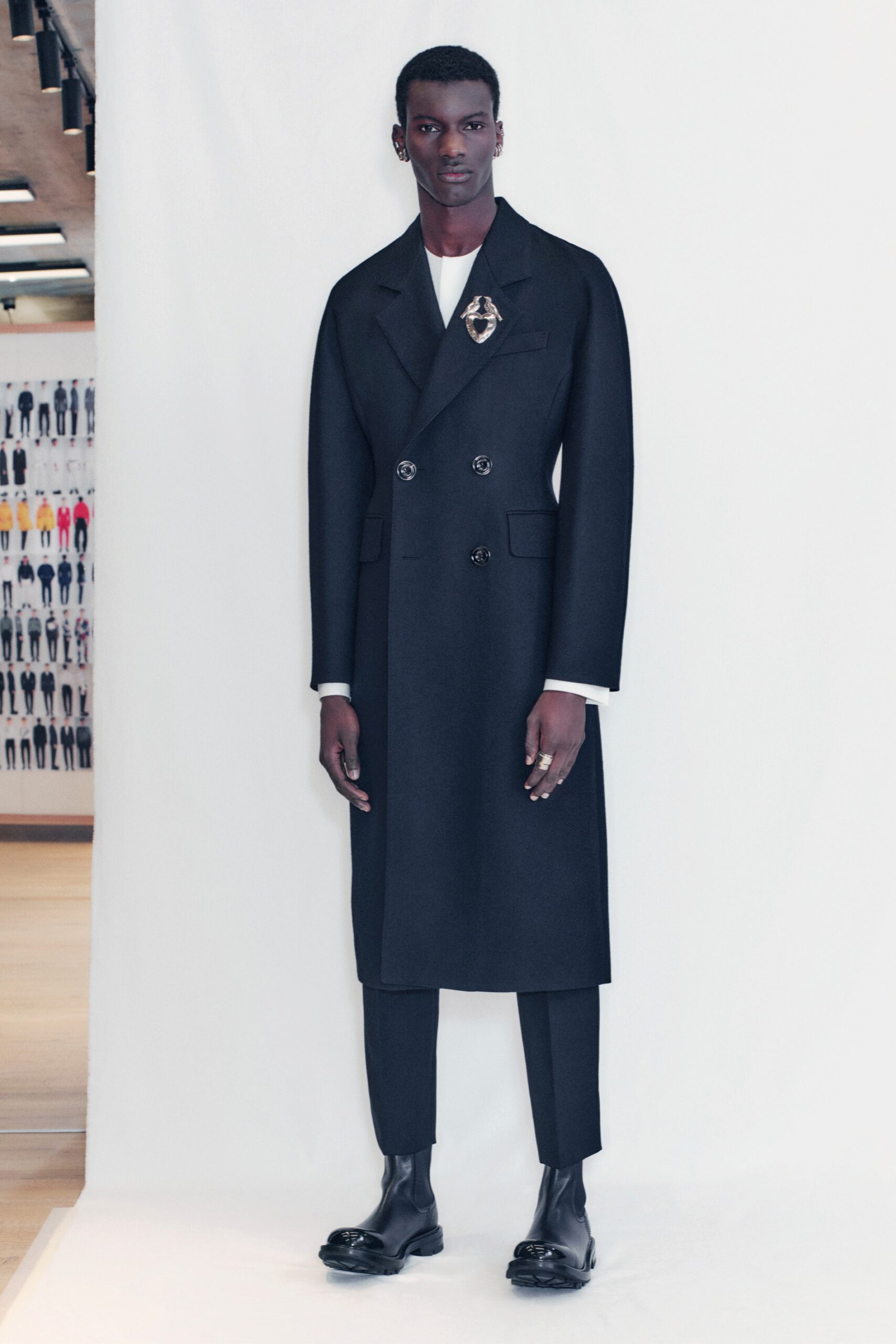 black tailored coat with slim pants