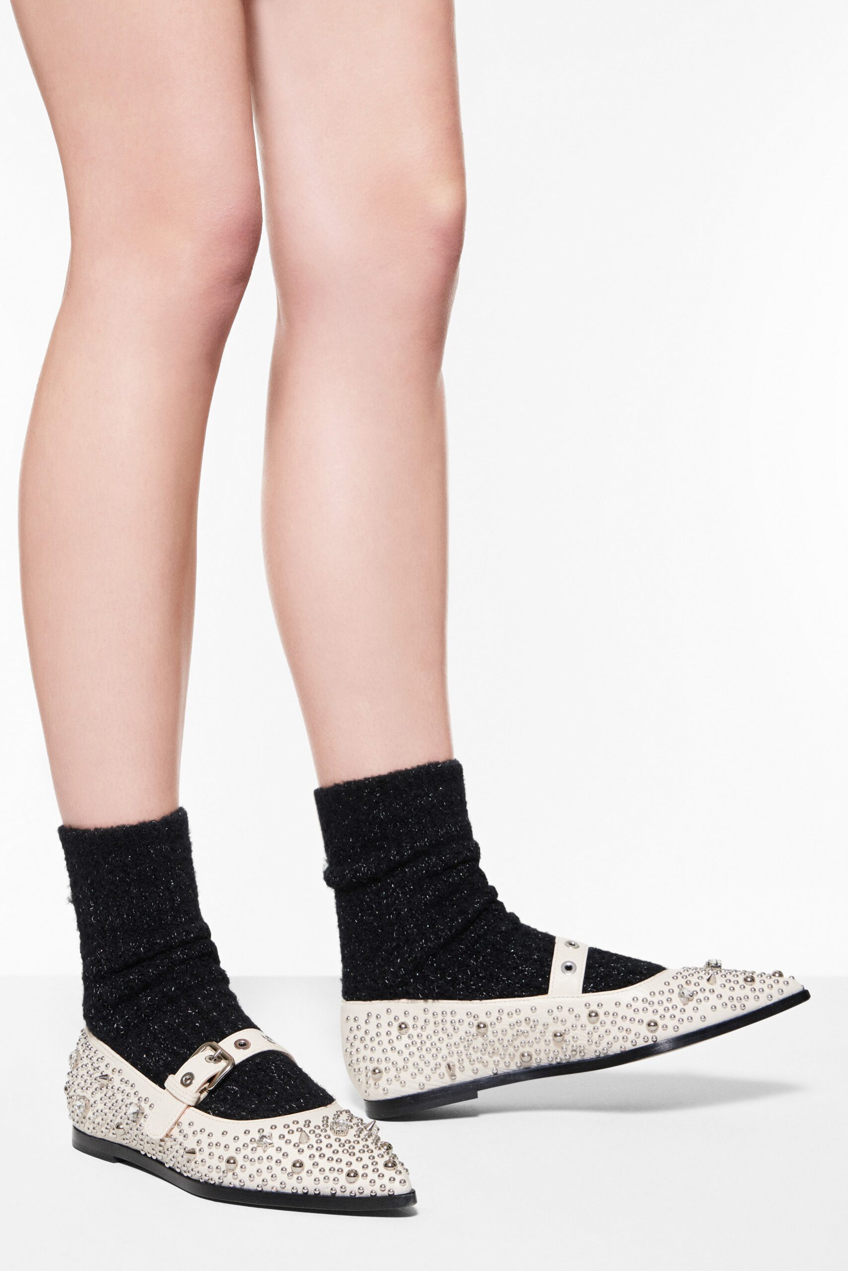 beaded white shoes with black socks