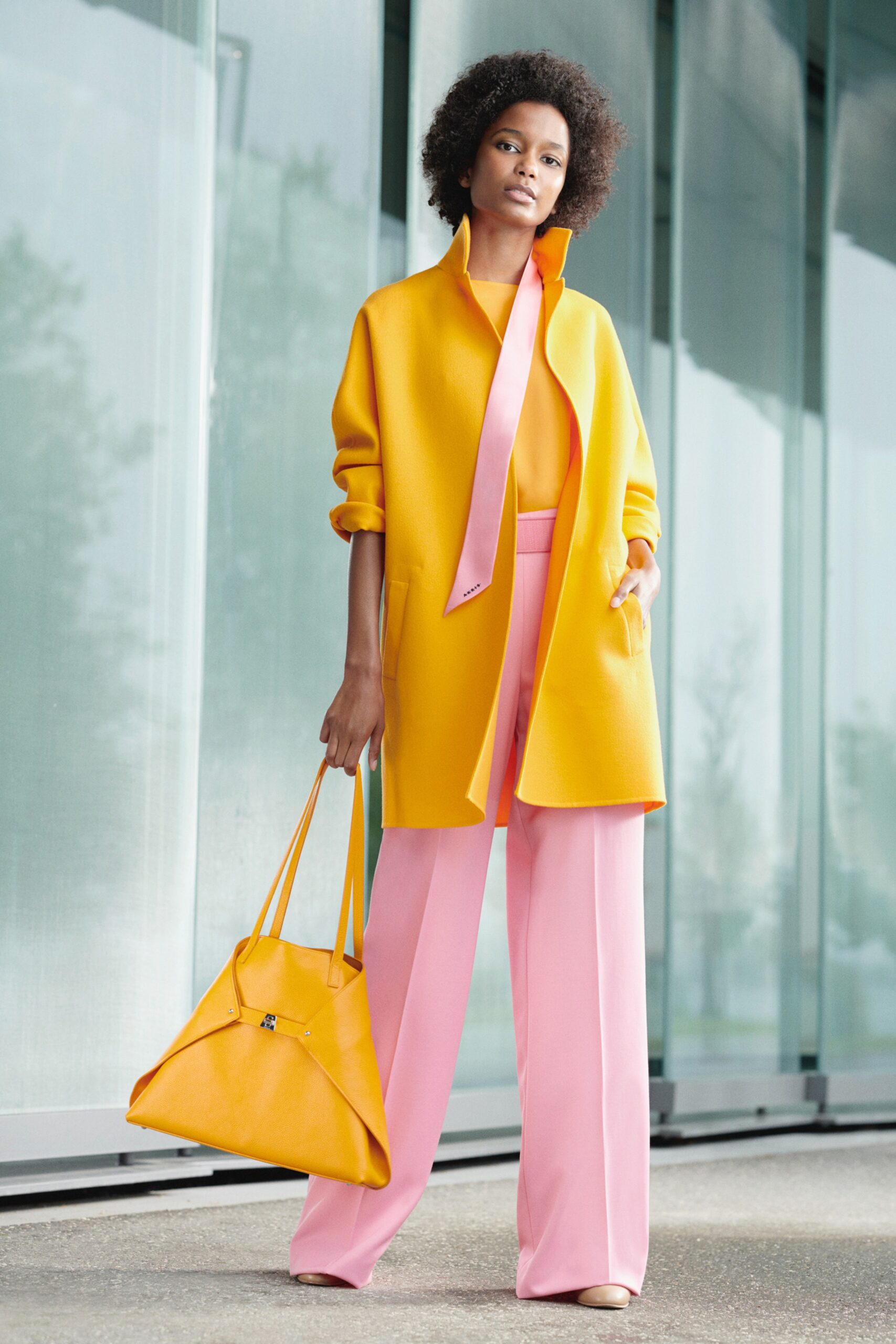 yellow coat orange top pink pants