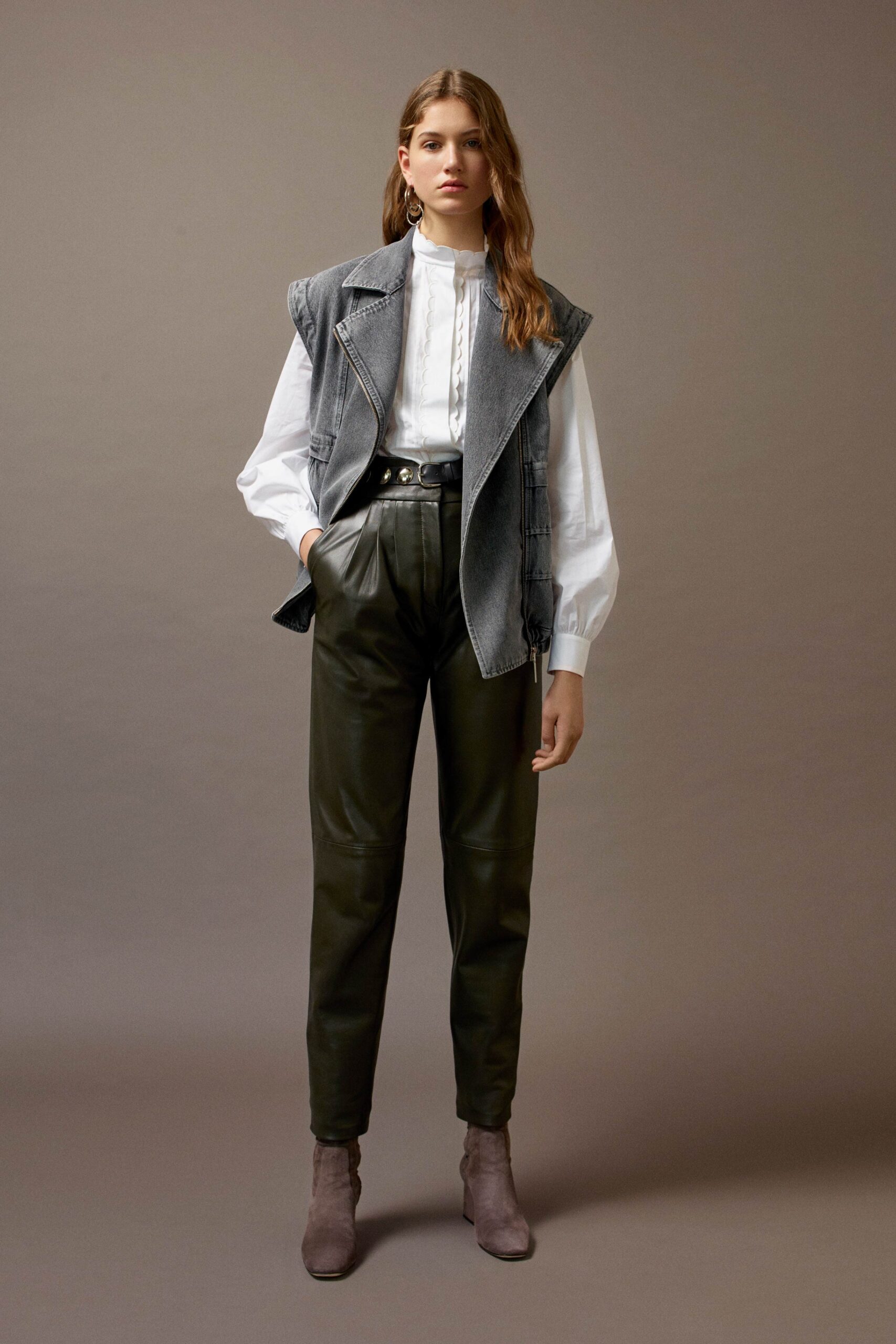 gray denim vest with white blouse
