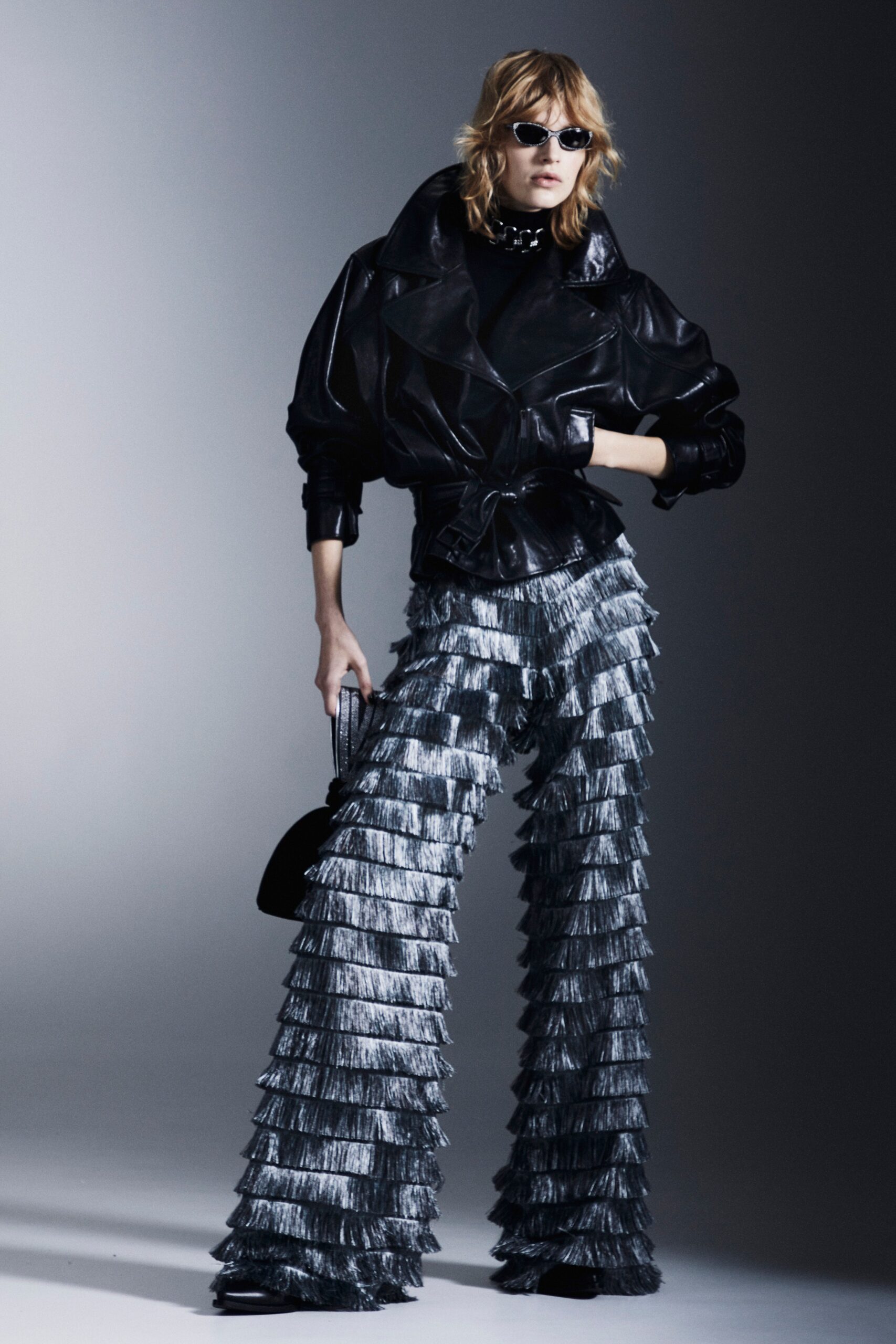 black leather jacket with fringed pants