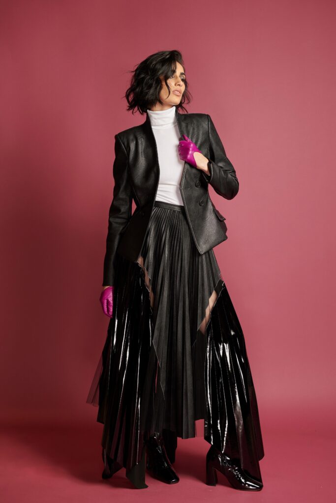 black leather blazer with pleated skirt