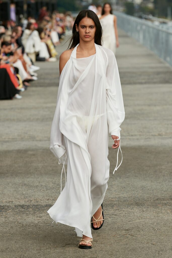 white flowing maxi dress with outerwear