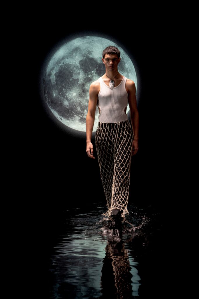 fitted white sleeveless top and relaxed black cargo pants