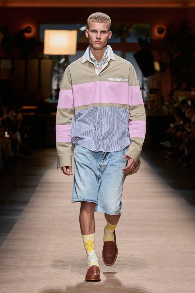 A relaxed-fit color-blocked shirt with long sleeves paired with denim shorts.
