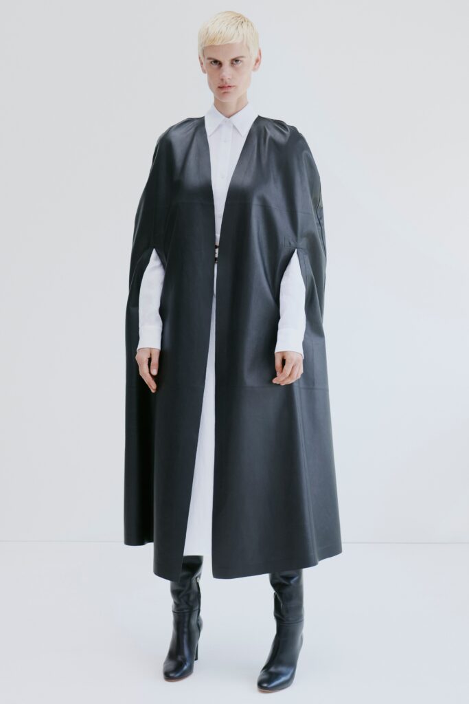 black leather cape with white shirt