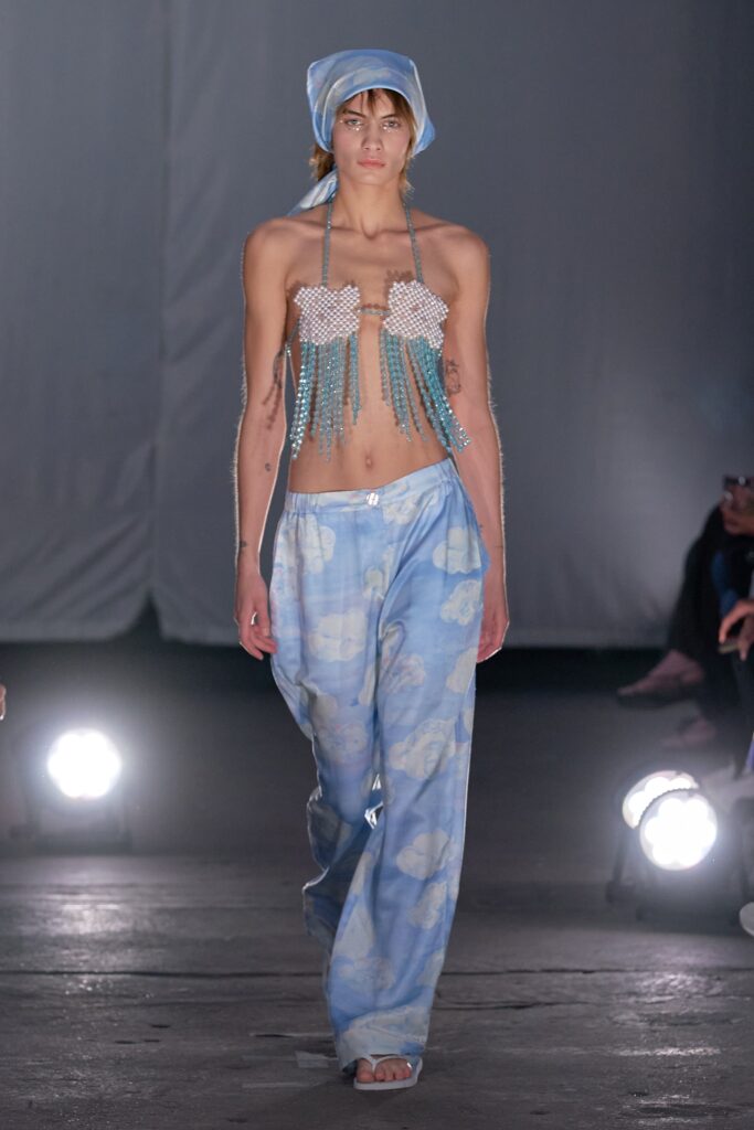 A relaxed fit blue printed top with low-cut design paired with matching pants.