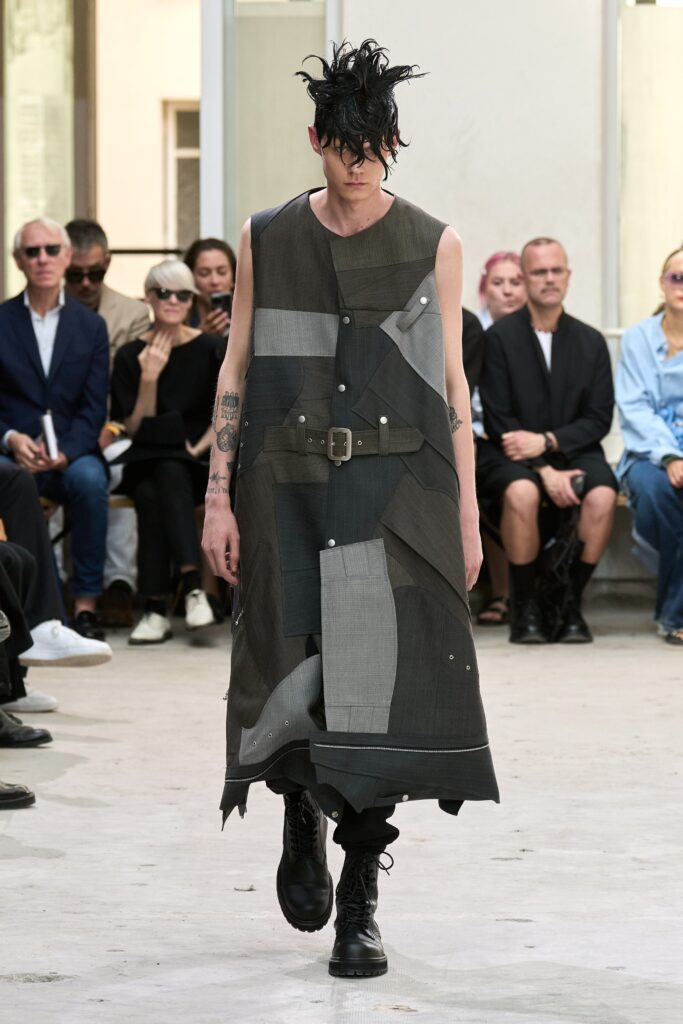 A relaxed black and gray asymmetric sleeveless dress with a collared design.