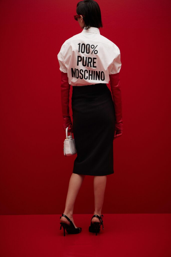 A fitted white printed top with short sleeves paired with a fitted black pencil skirt.