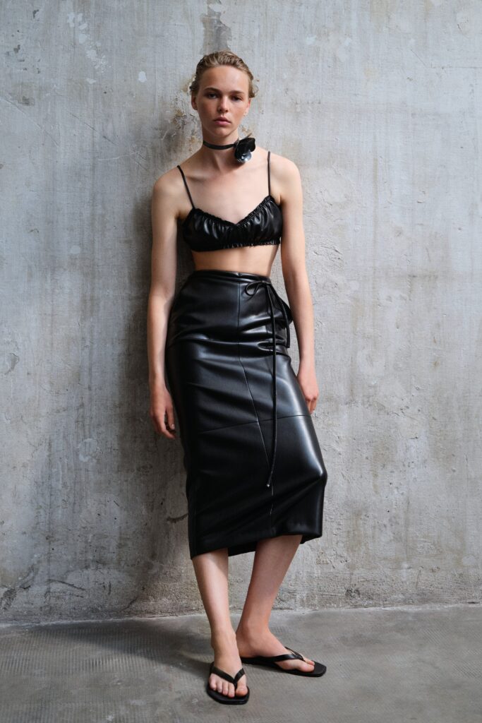 black leather fitted top and skirt