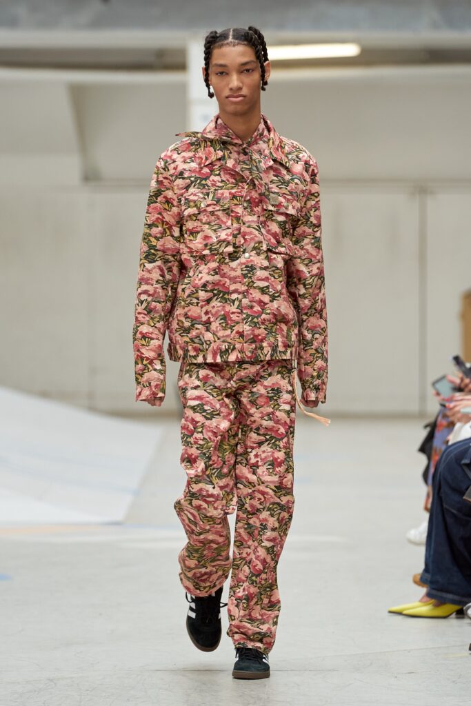 A relaxed fit pink printed jacket with matching pants, showcasing a vibrant floral design.