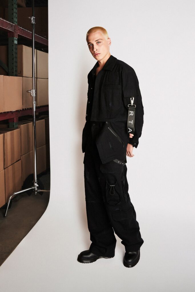 A relaxed black jacket with long sleeves and collared design paired with matching pants.