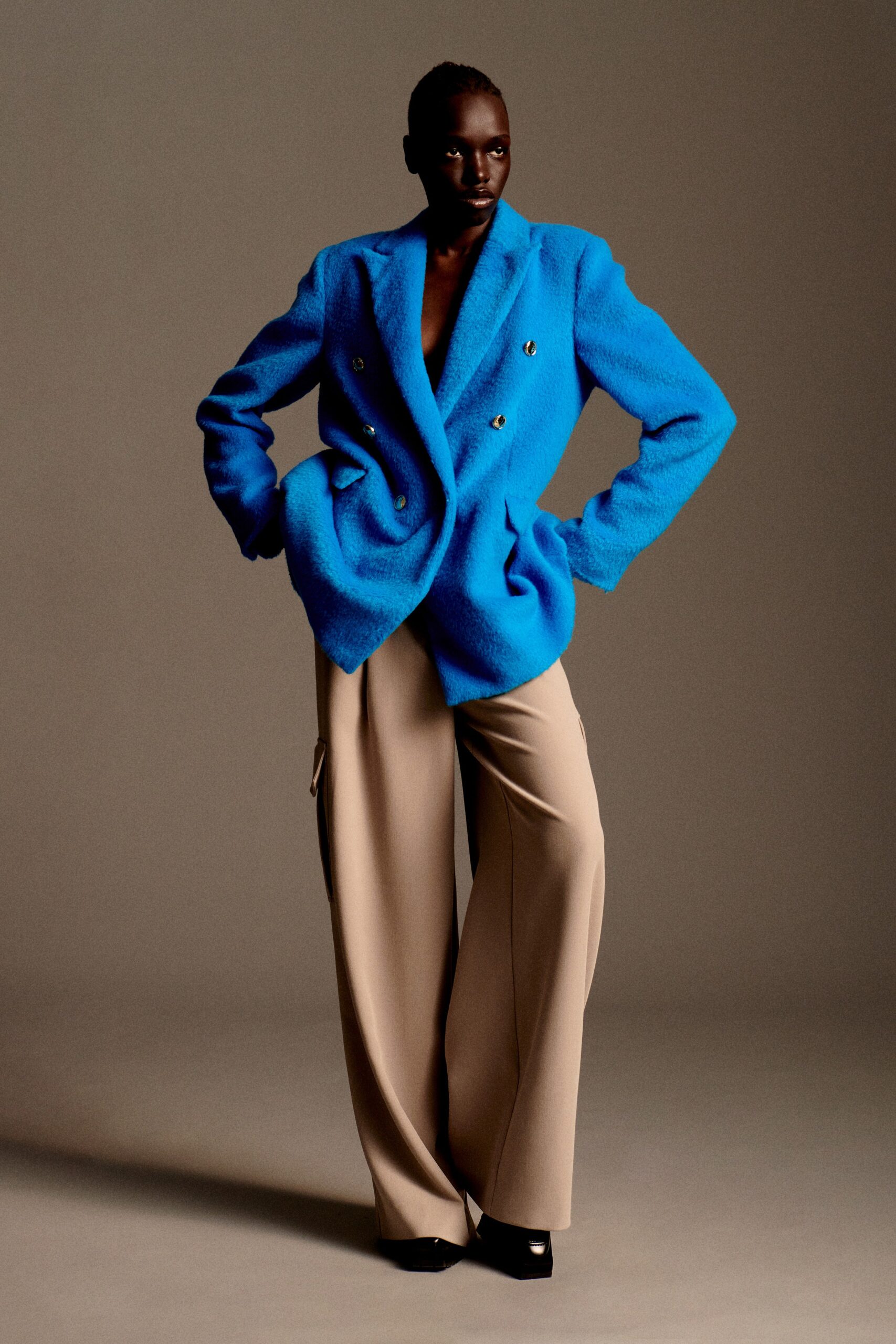 blue oversized blazer and beige pants