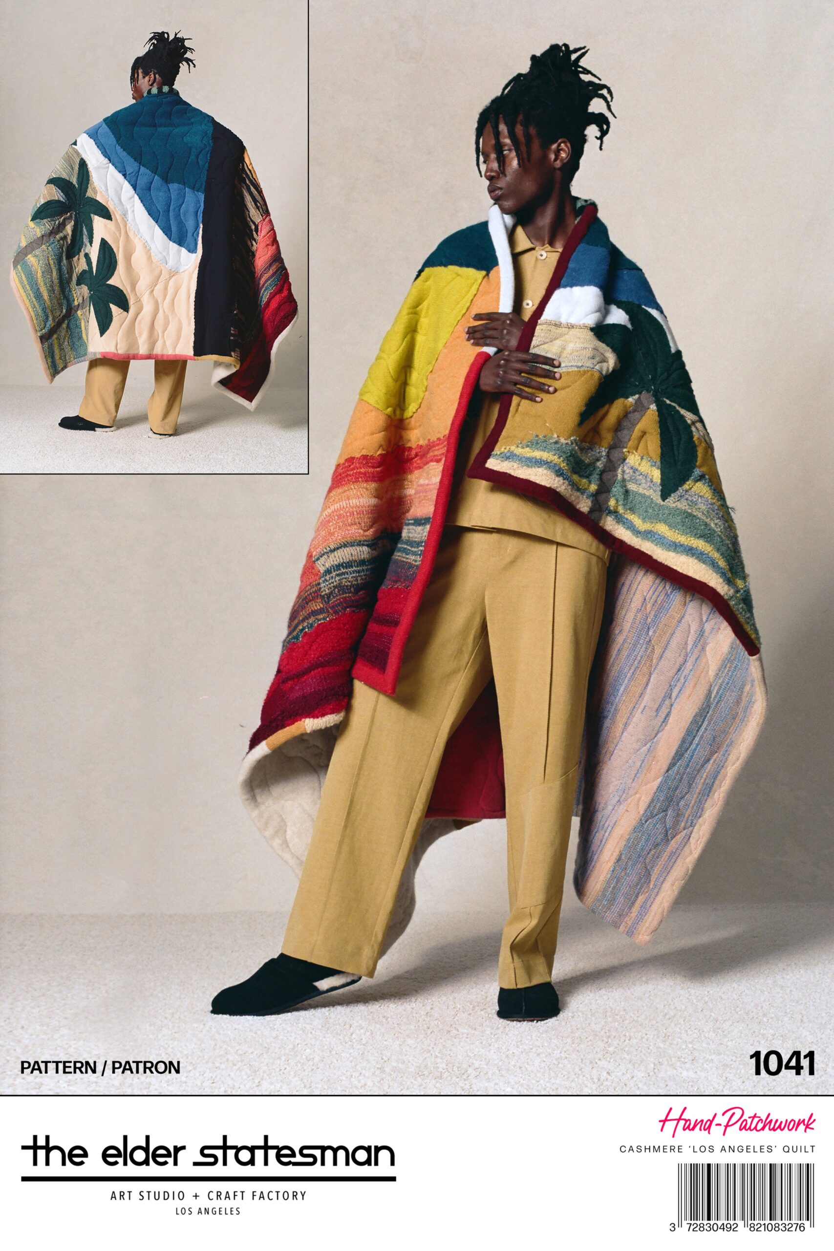 A relaxed multicolor cape paired with beige pants, showcasing a layered design.