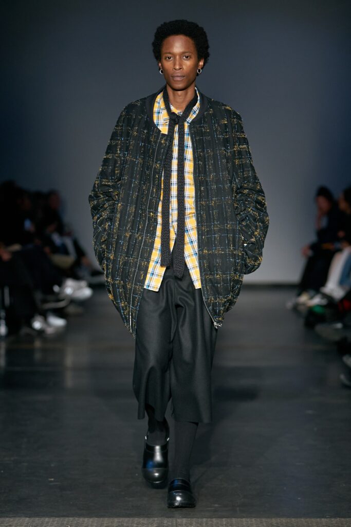 relaxed black jacket with checked shirt