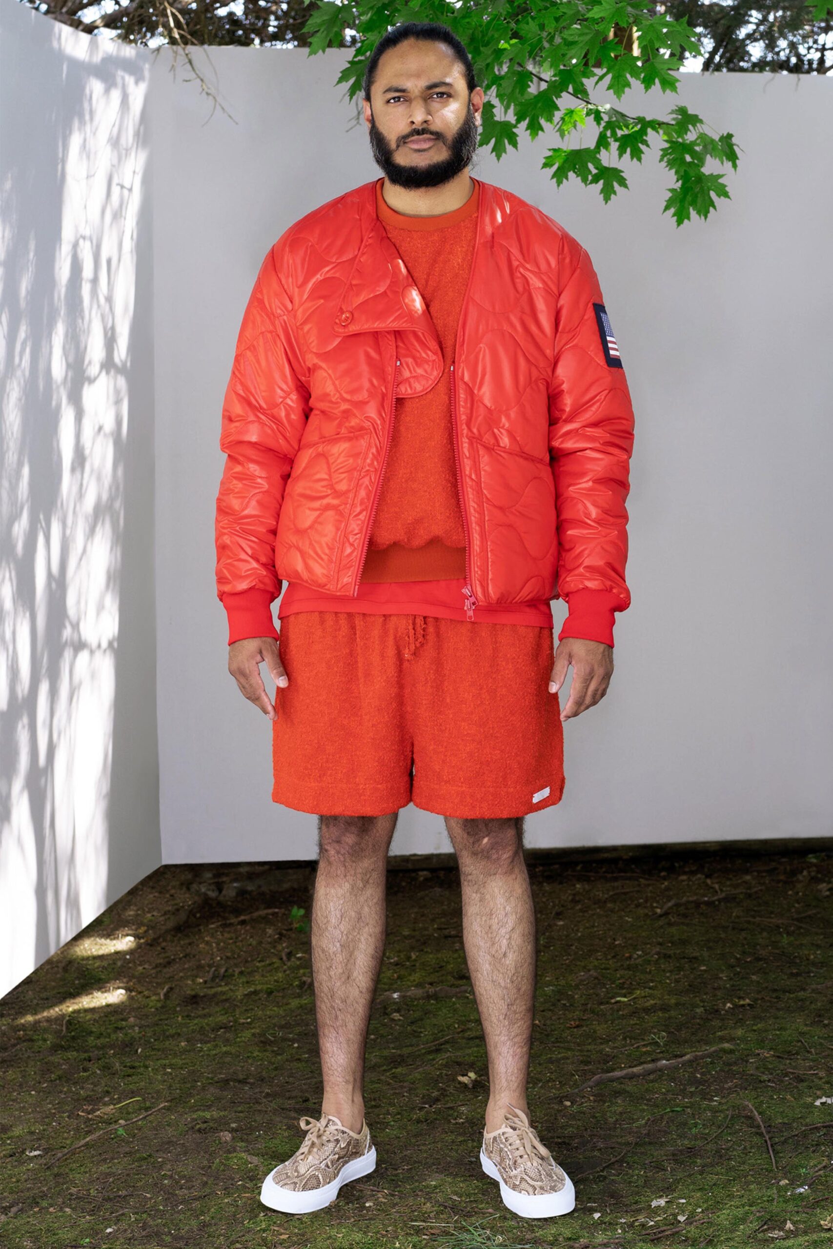 A relaxed red jacket with a crew-neck and matching shorts, perfect for casual wear.