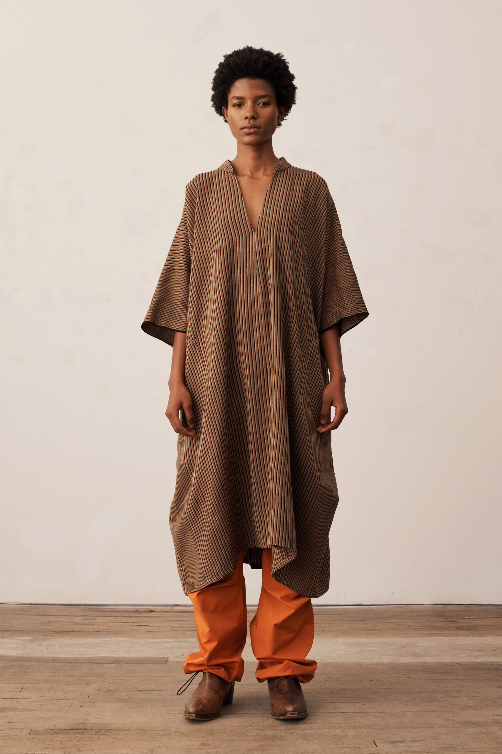 brown striped midi dress with orange pants