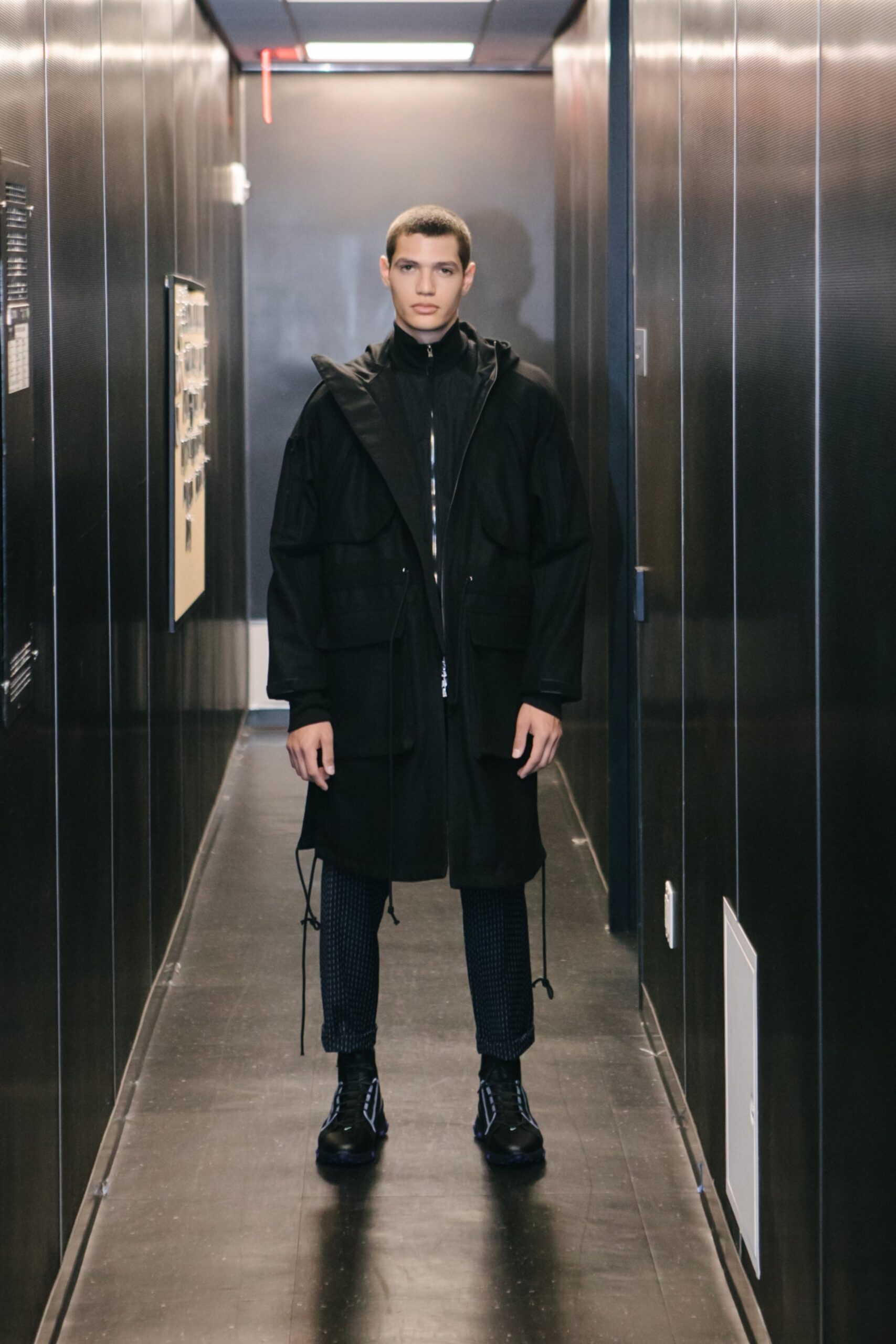 black relaxed coat with slim pants