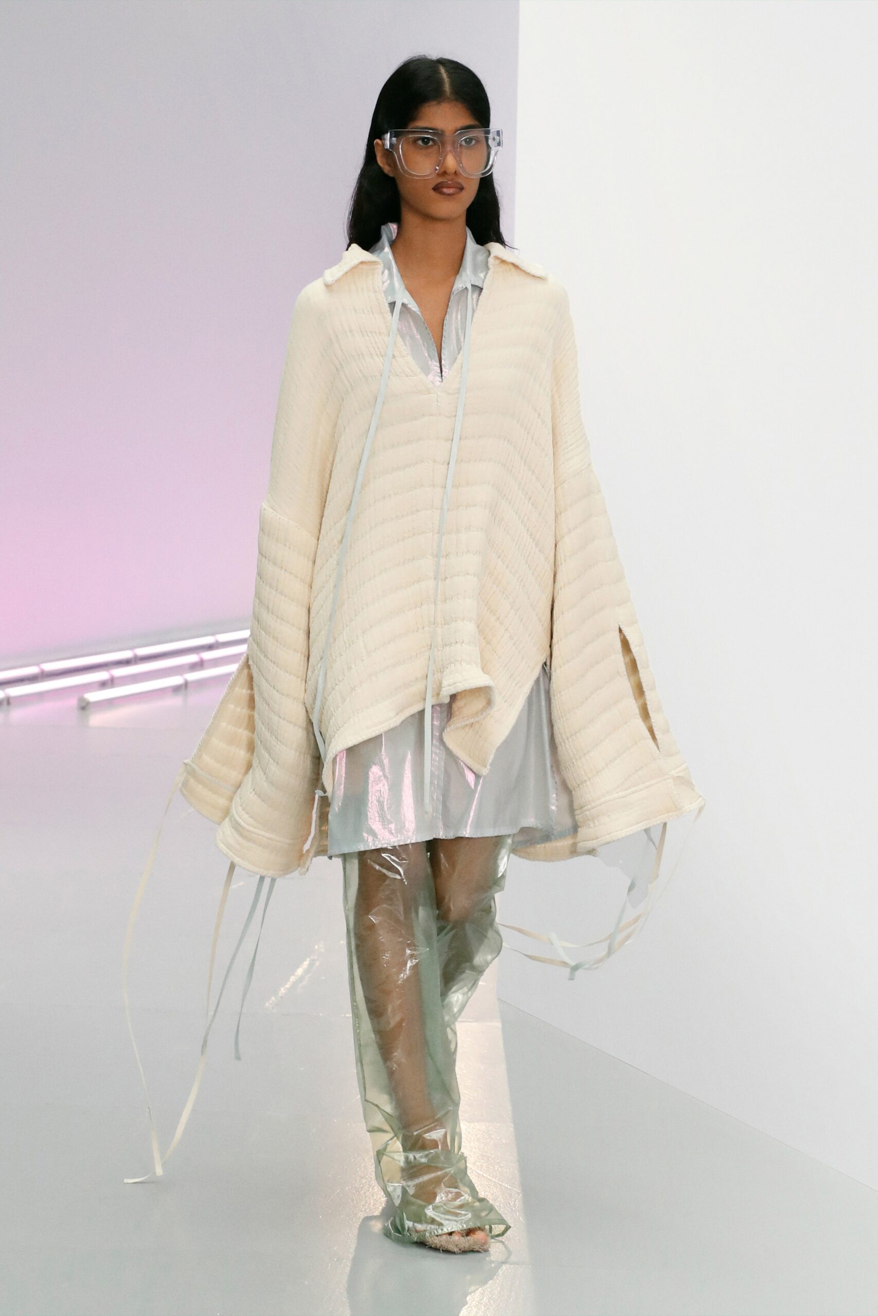 beige poncho with silver shirt