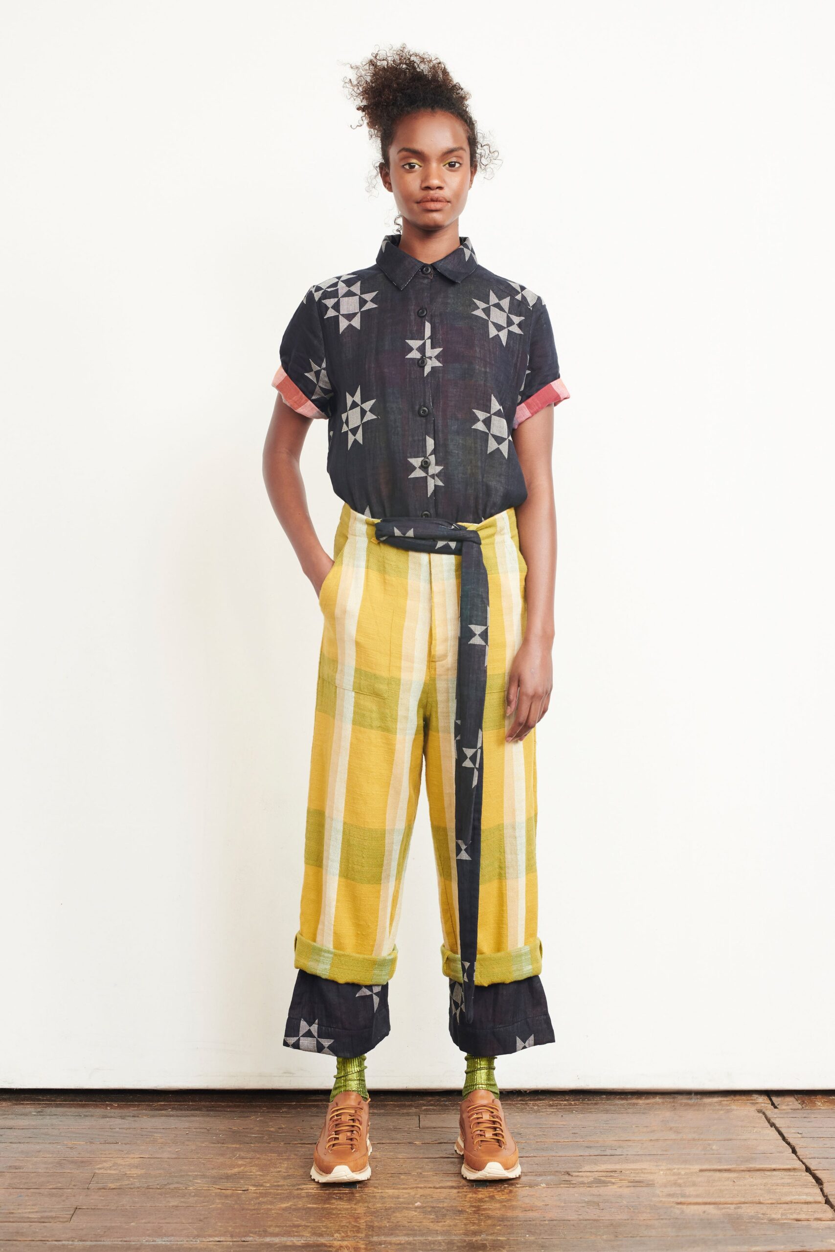 black printed shirt with yellow pants