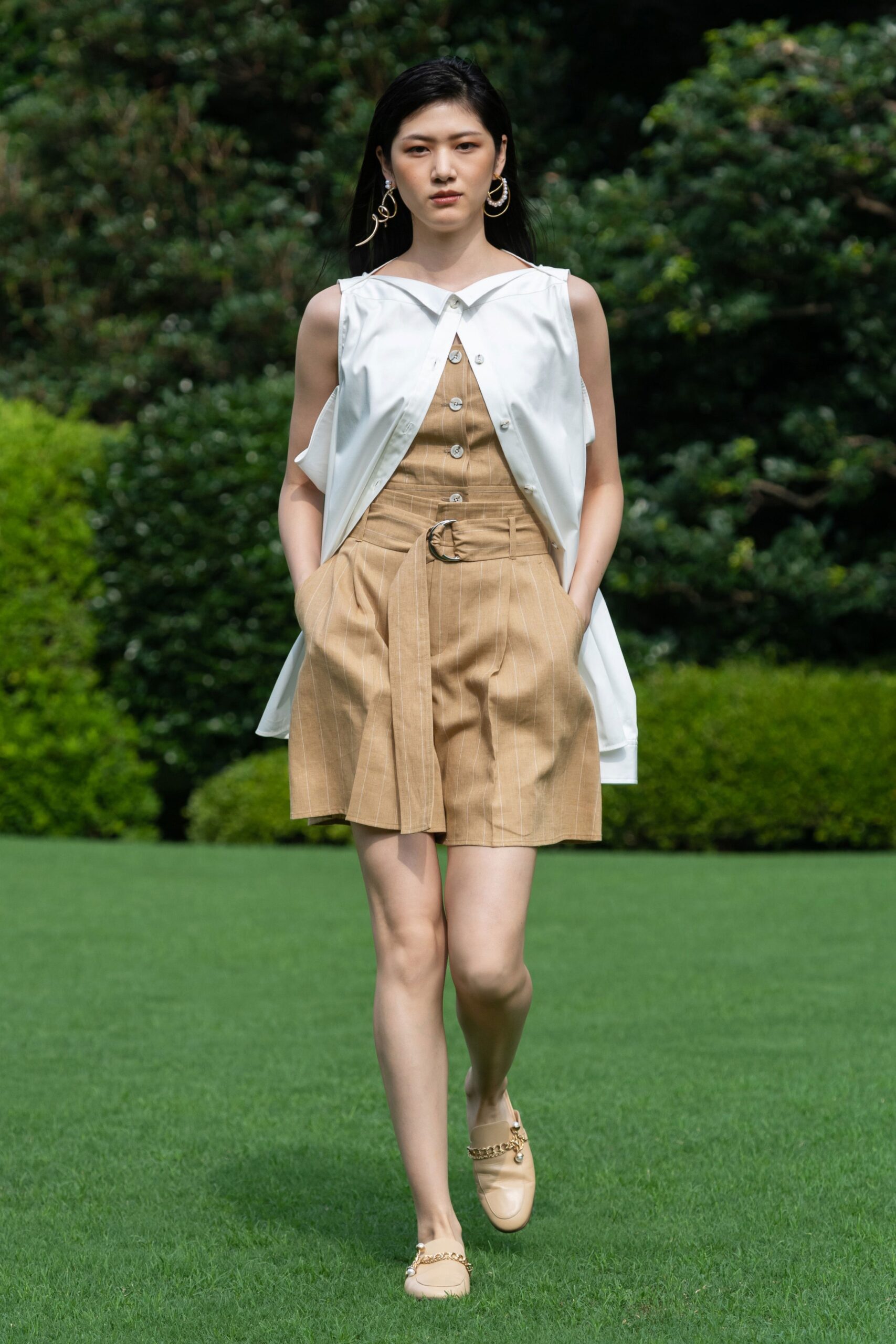 beige cotton sleeveless collared fitted buttoned pockets jumpsuit