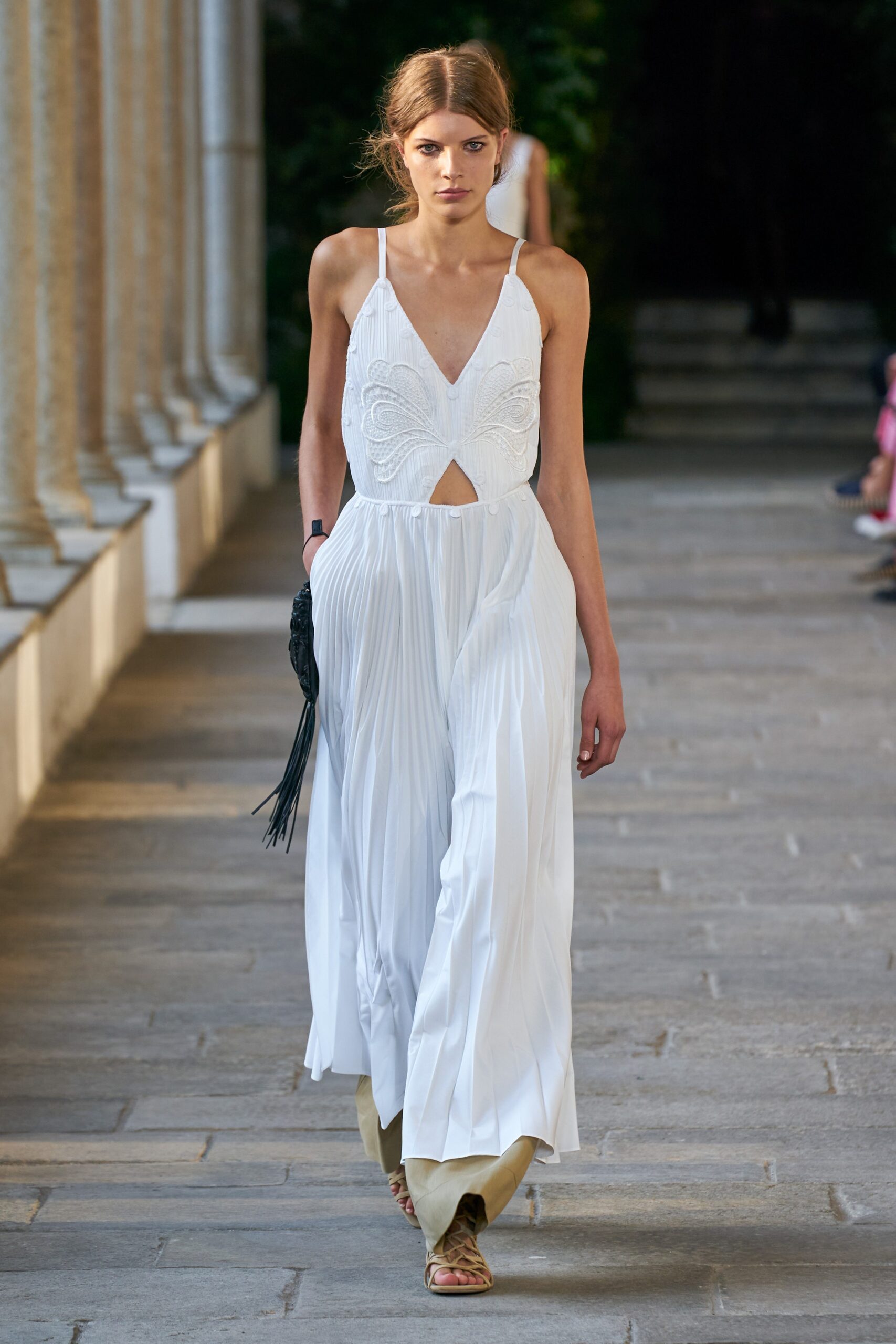 white pleated sleeveless dress