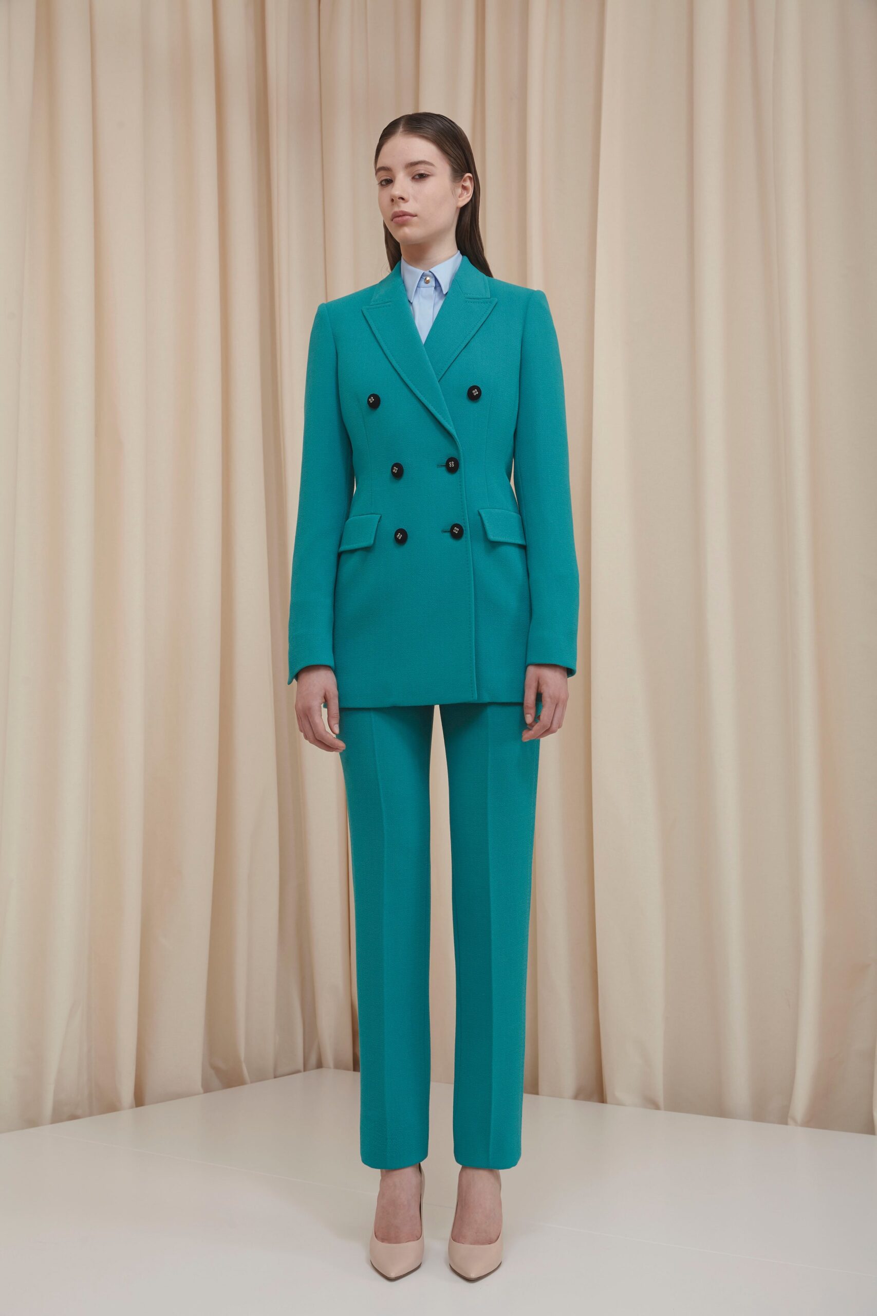 blue tailored suit with beige shoes