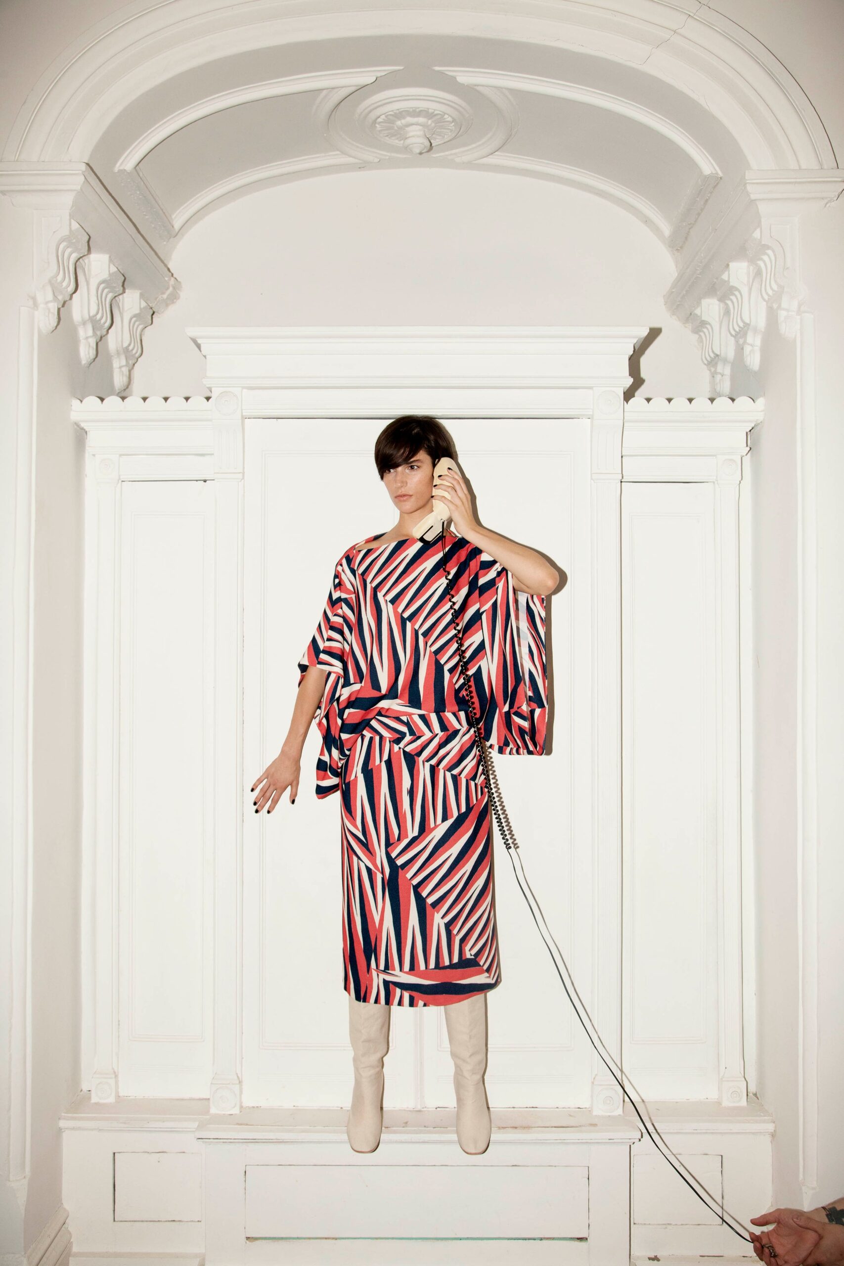 A relaxed red and blue dress with short sleeves and an asymmetric design.