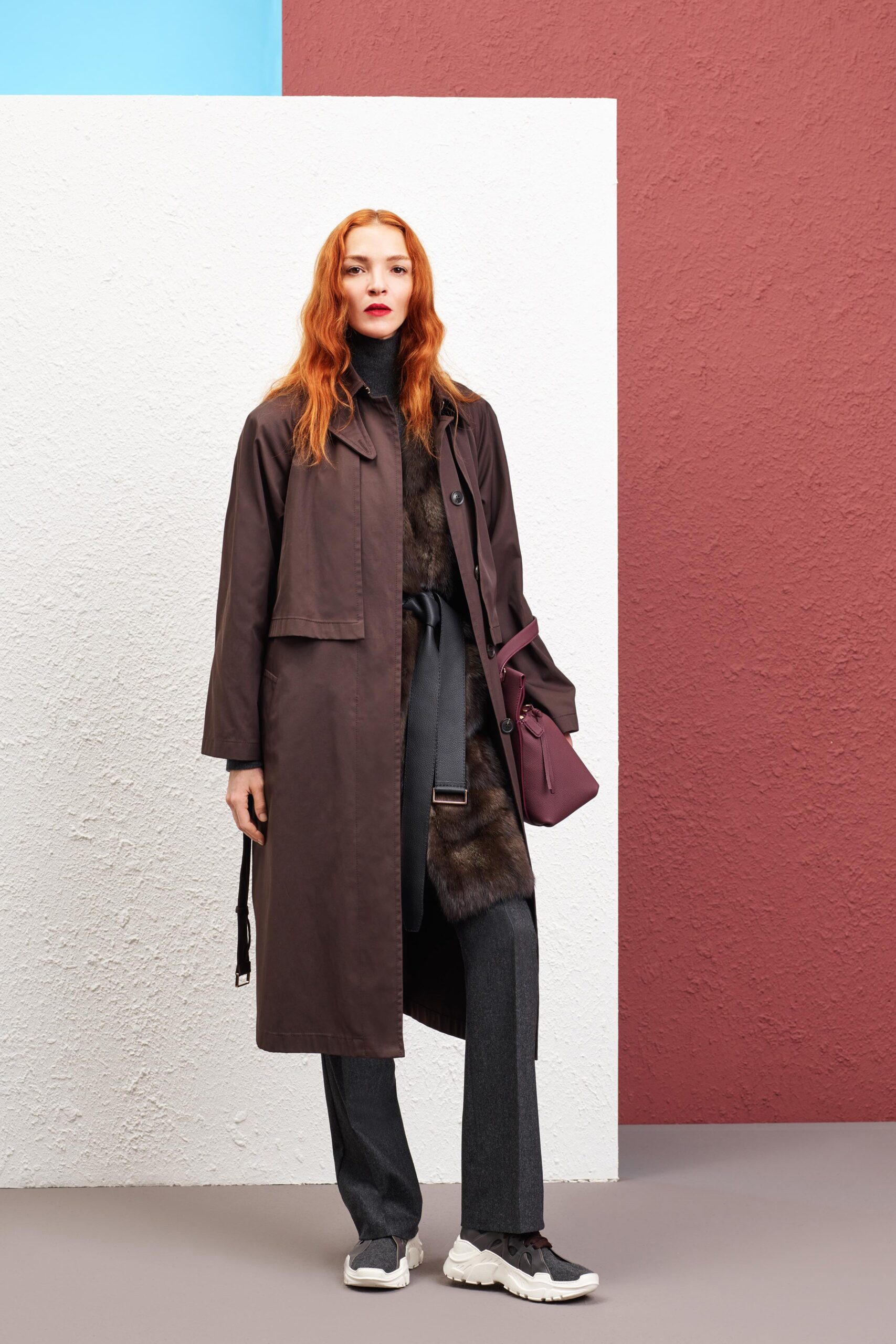 brown faux-fur coat with gray pants