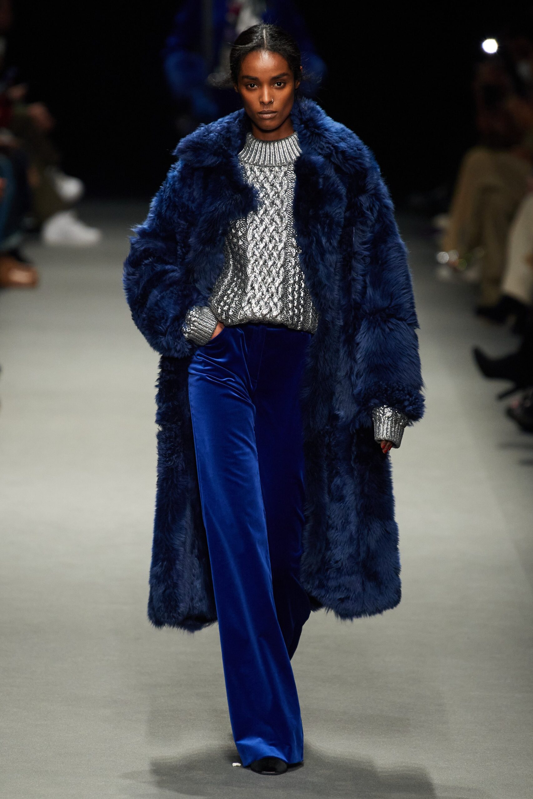blue faux-fur coat with gray knit top
