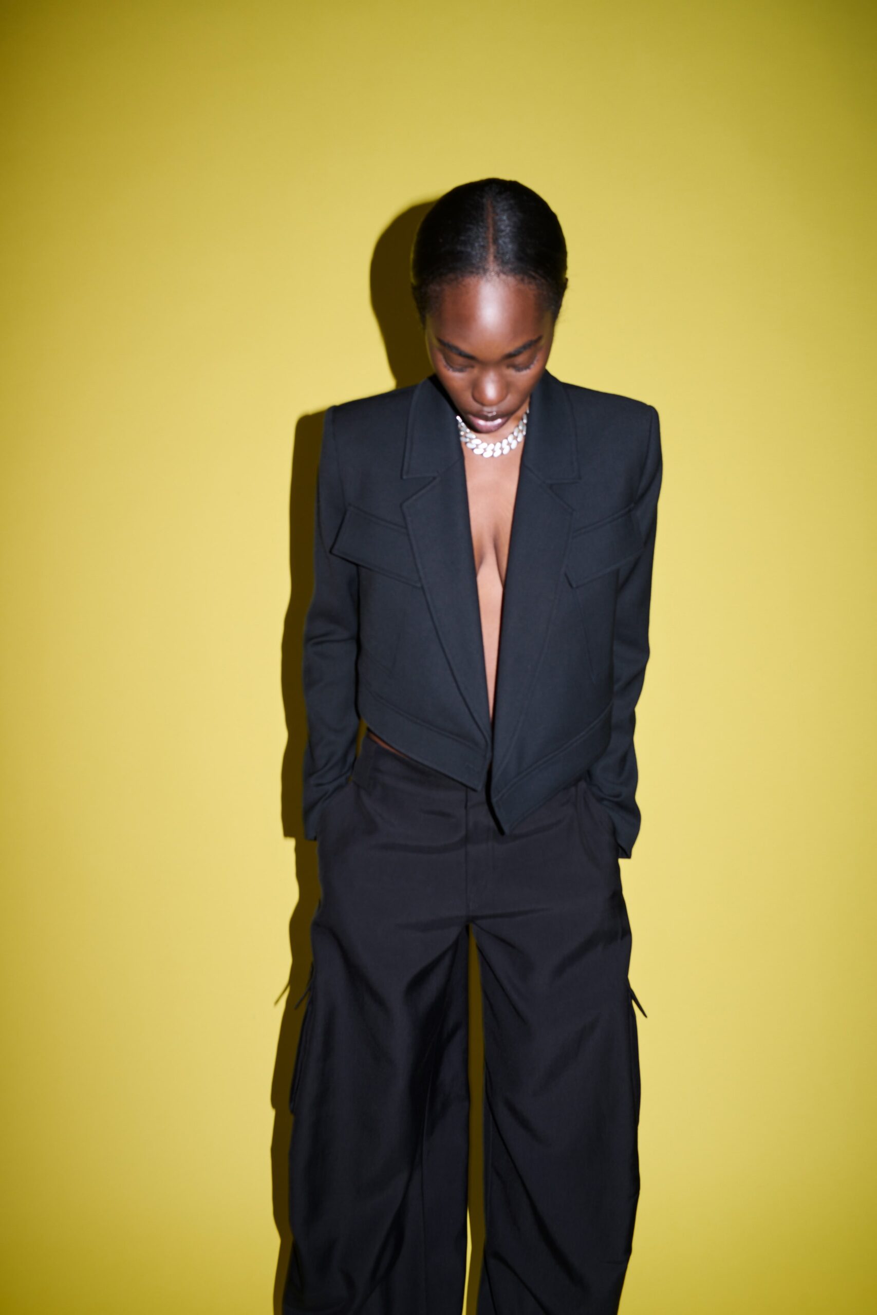 black fitted blazer and relaxed pants