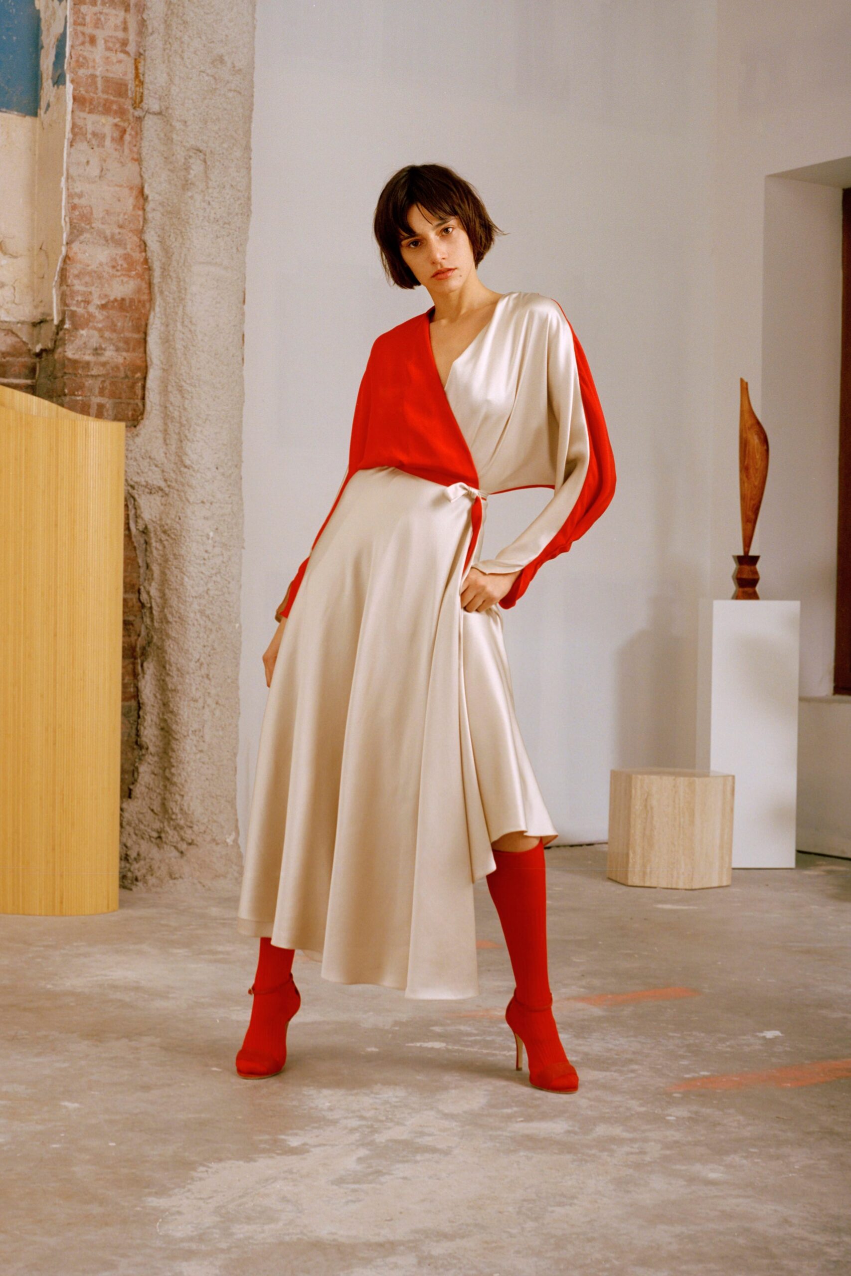 red silk long-sleeve v-neck fitted draped flowing dress