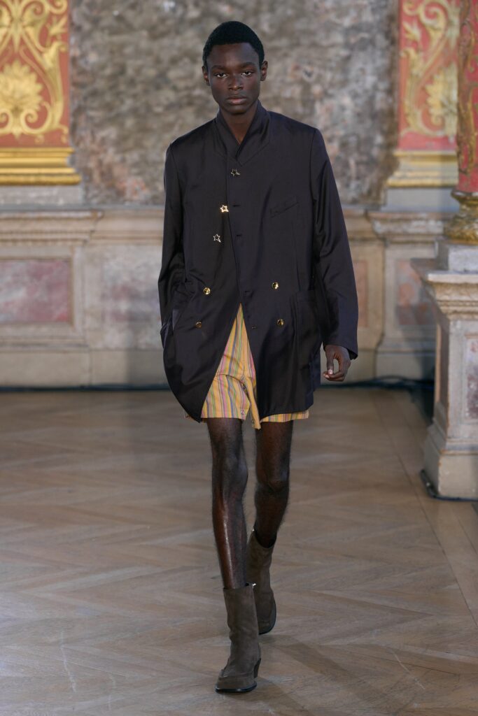 black coat with striped shorts