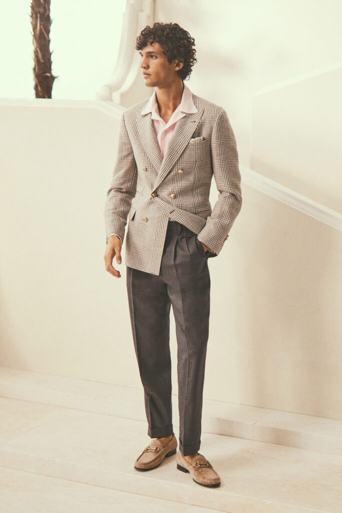 A tailored gray checked blazer paired with pink collared shirt and trousers.
