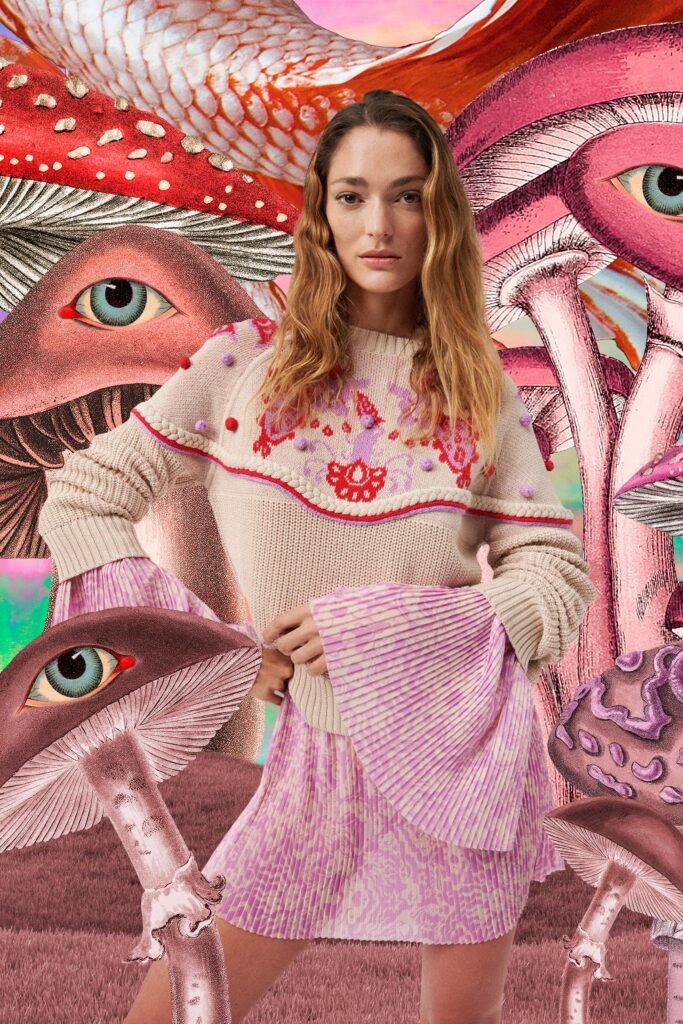 A fitted beige embroidered sweater paired with a pink pleated skirt, creating a stylish ensemble.