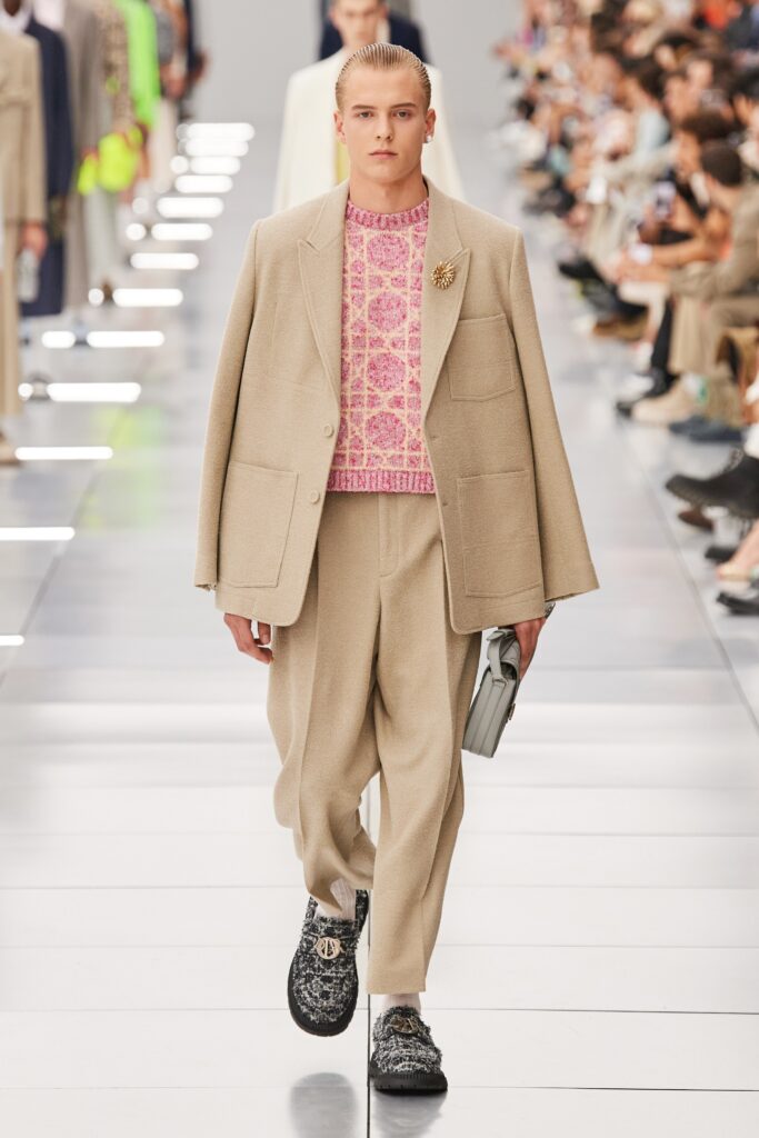 A relaxed beige wool blazer paired with straight-leg pants for a sophisticated look.
