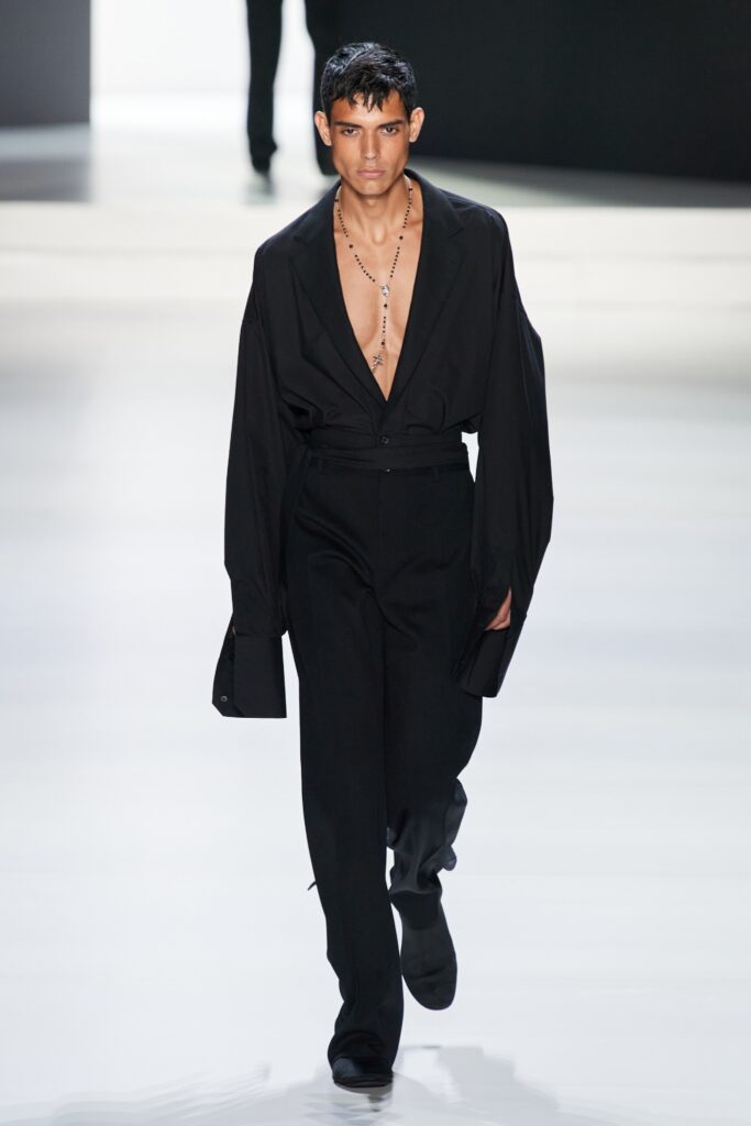 A relaxed black long-sleeve shirt with a V-neck and matching pants.