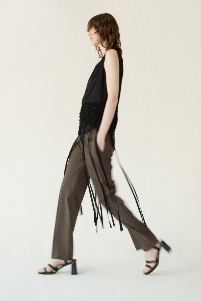 black fitted top brown pants