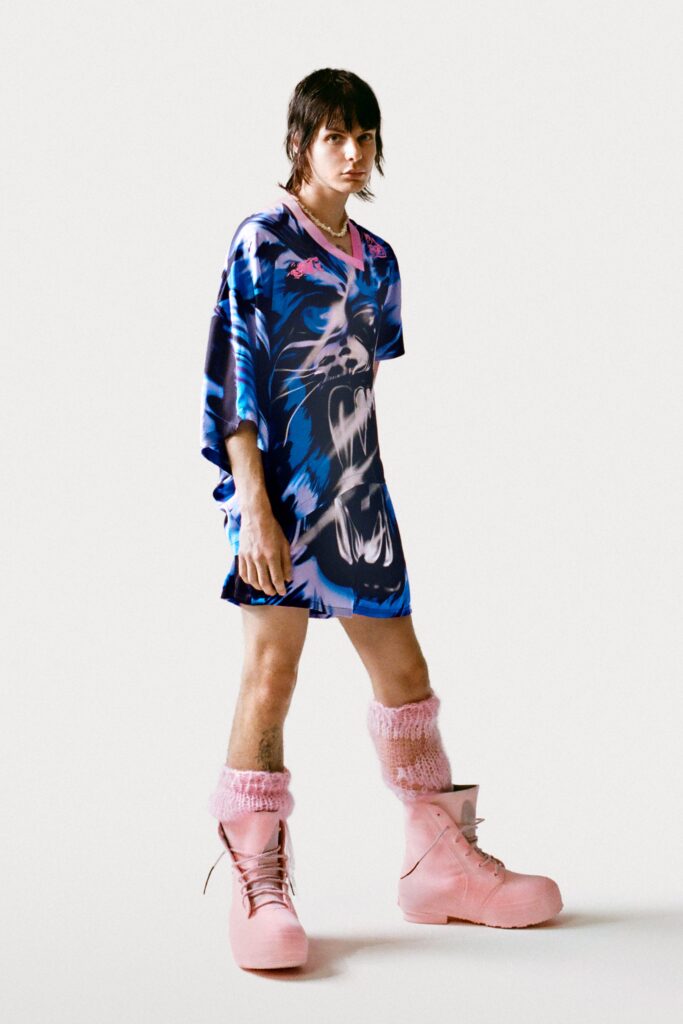 An oversized blue dress with short sleeves and a vibrant graphic print.