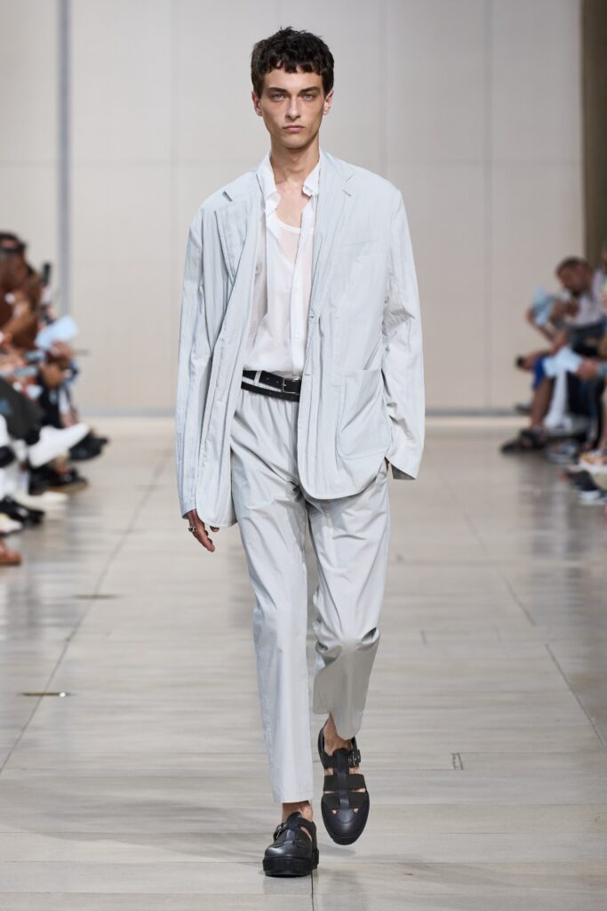 A relaxed gray cotton suit with a long-sleeve collared shirt and buttoned details.