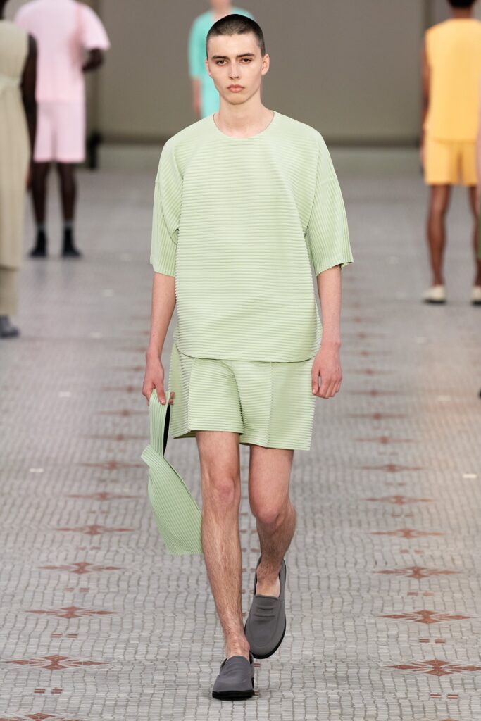 A relaxed green cotton top with short sleeves and pleated design paired with matching shorts.
